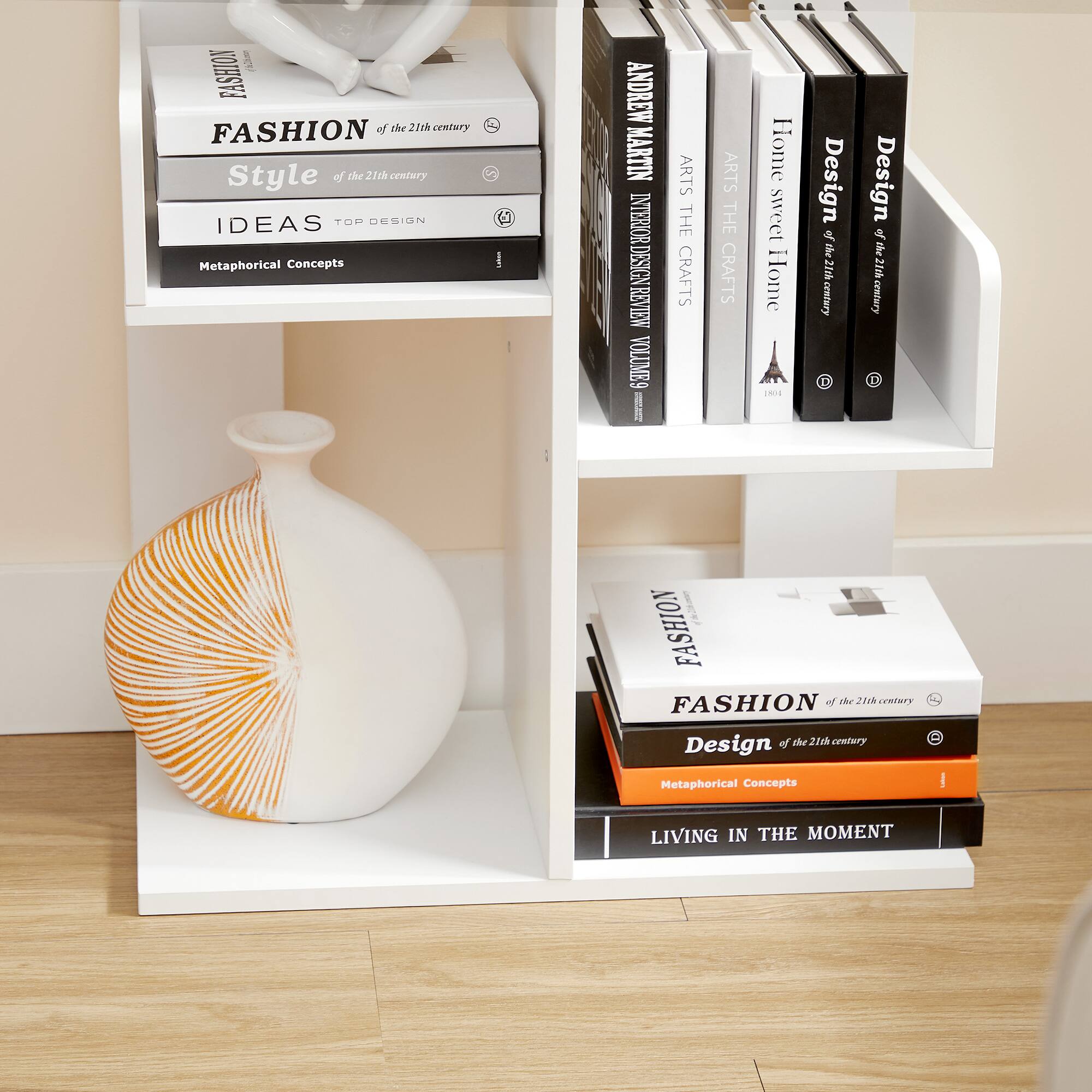 Sure, here is the corrected and grouped text from the image:

---

**Top Shelf:**

- **FASHION** of the 21st century
- **Style** of the 21st century
- **IDEAS** TOP DESIGN
- **Metaphorical Concepts**

**Middle Shelf:**

- **ANDREW MARTIN** INTERNATIONAL REVIEW OF DESIGN VOLUME 9
- **ARTS** THE CRAFTS
- **ARTS** THE CRAFTS
- **Home sweet Home** a1 Design of the 21st century
- **Design** of the 21st century

**Bottom Shelf:**

- **FASHION** of the 21st century
- **Design** of the 21st century
- **Metaphorical Concepts**
- **LIVING IN THE MOMENT**

---