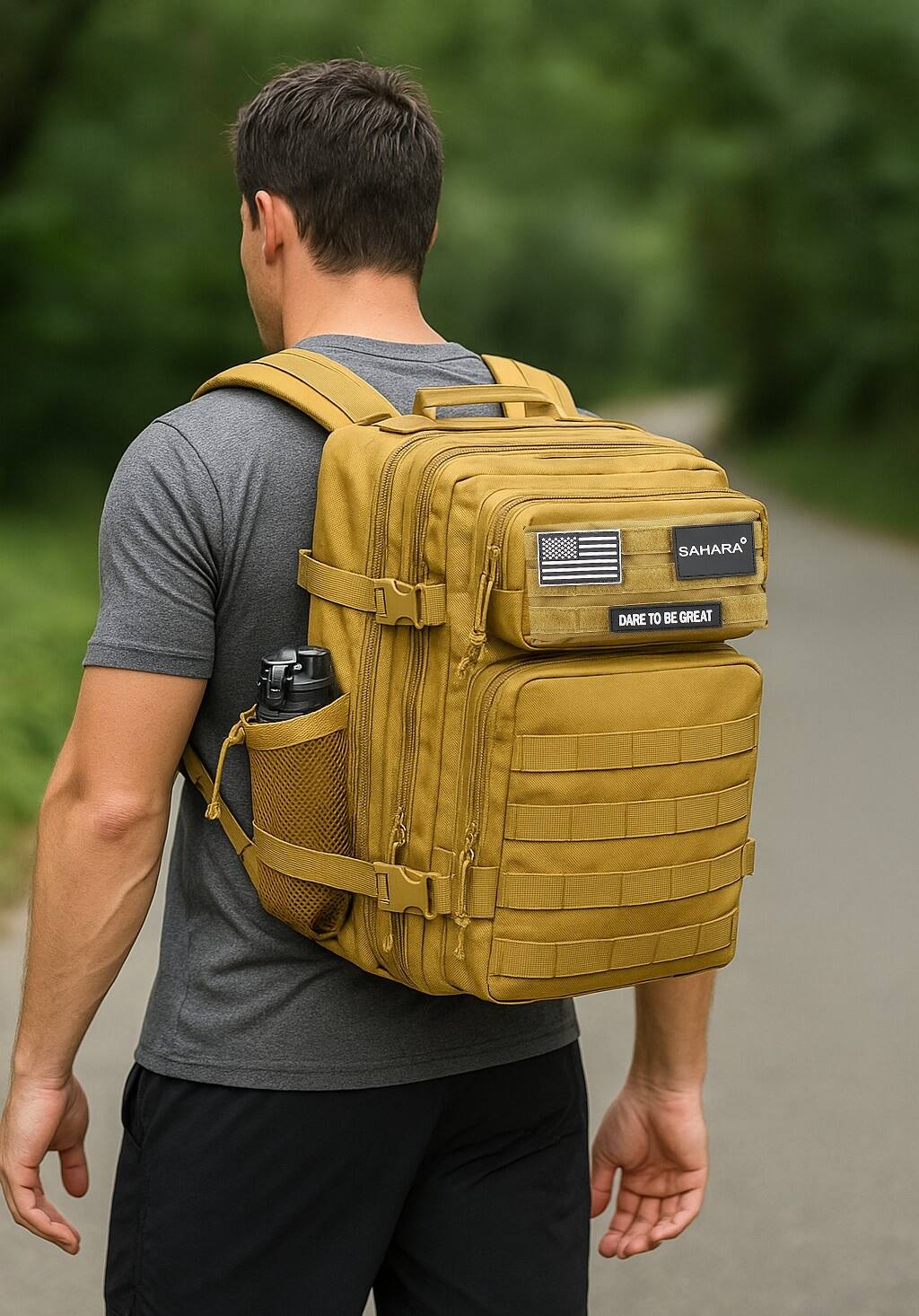 The man in the image is wearing a backpack that says "Sahara Dare to be Great."