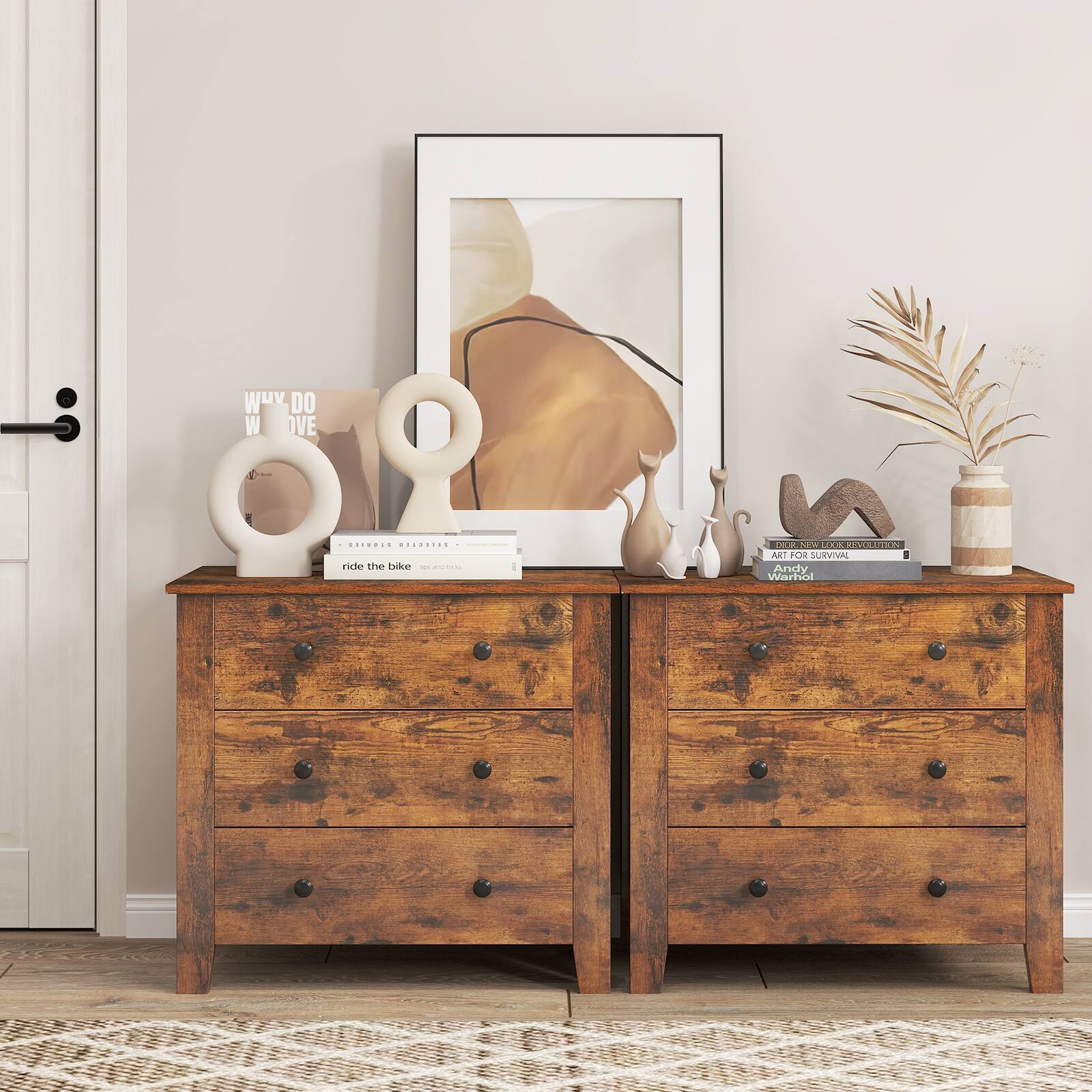 Sure, here is the corrected and grouped text from the image:

1. **On the left side:**
   - "WHY DO WE LOVE"
   - "ride the bike"
   - "spoon & fork"

2. **On the right side:**
   - "ART FOR SURVIVAL"
   - "Andy Warhol"

3. **On the framed picture:**
   - "Andy Warhol"

4. **On the small sign in front:**
   - "ride the bike"