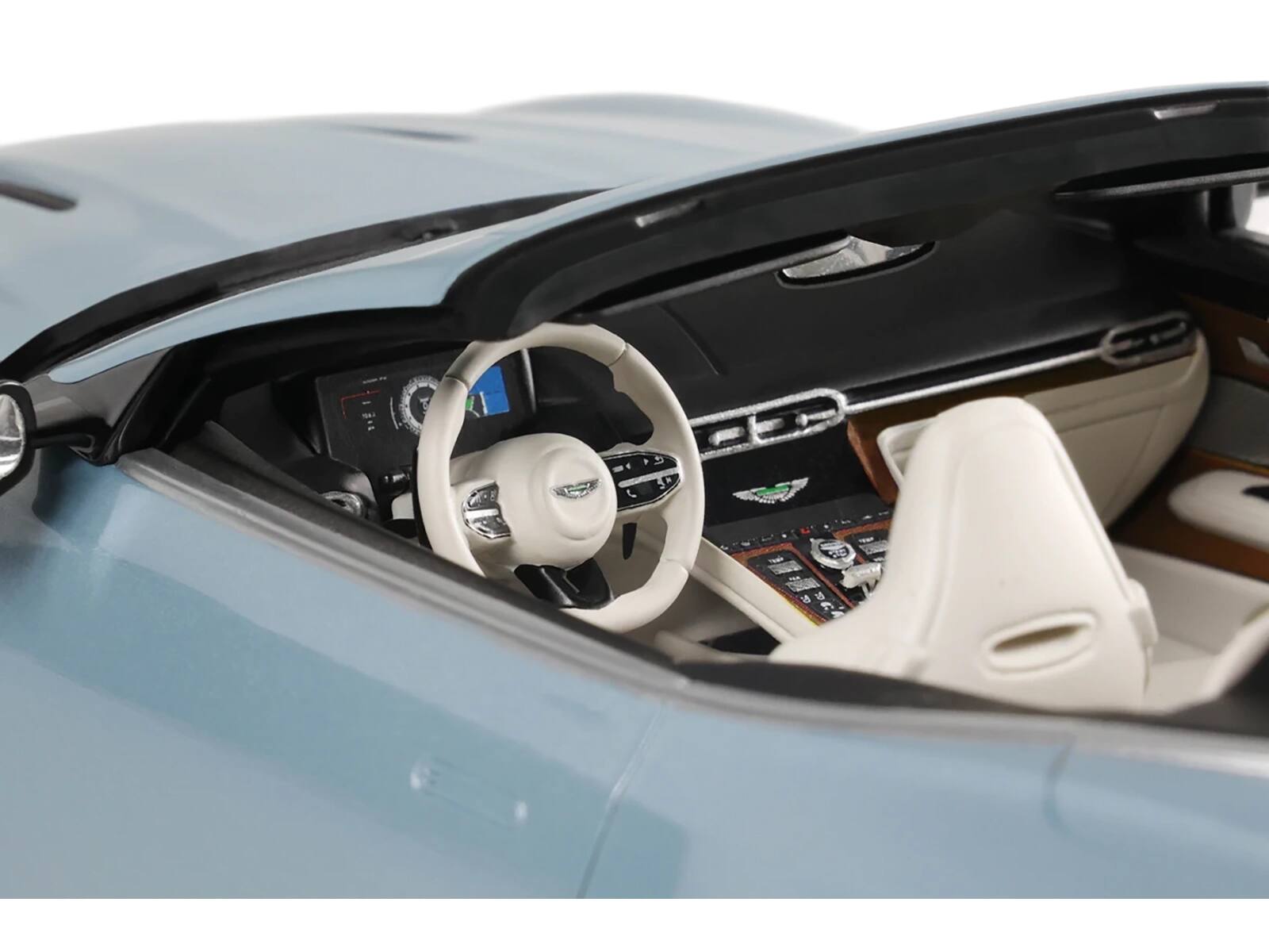 Left. GT Spirit - 2023 Aston Martin DB12 Volante Caribbean Blue Pearl with White Interior 1/18 Model Car by GT Spirit - Blue Pearl with White.