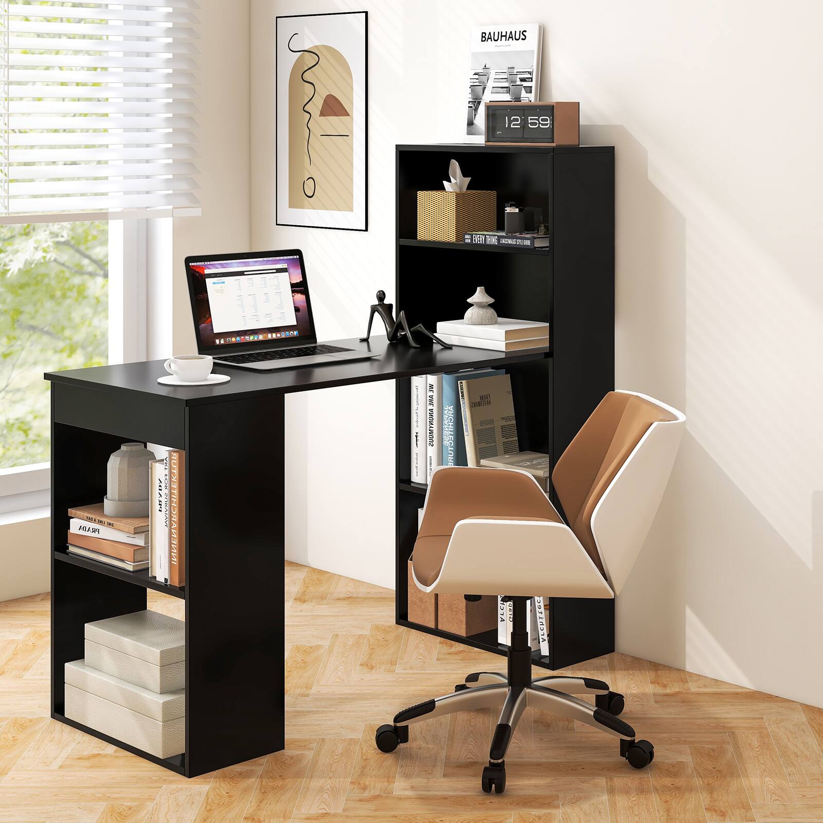The image features a black desk with a laptop, a cup, and a book on it. There is a chair positioned in front of the desk. The desk is situated next to a window, providing natural light to the workspace. Additionally, there is a shelf with books and other items on it. The scene appears to be a well-organized and functional home office setup.