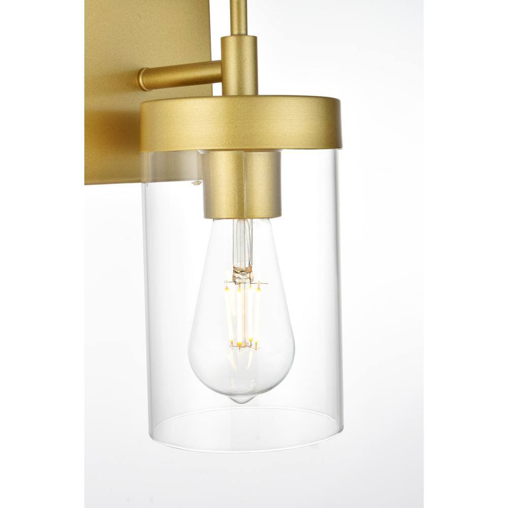 Left. Living District - Benny 1 light Brass and Clear Bath Sconce - Brass And Clear.