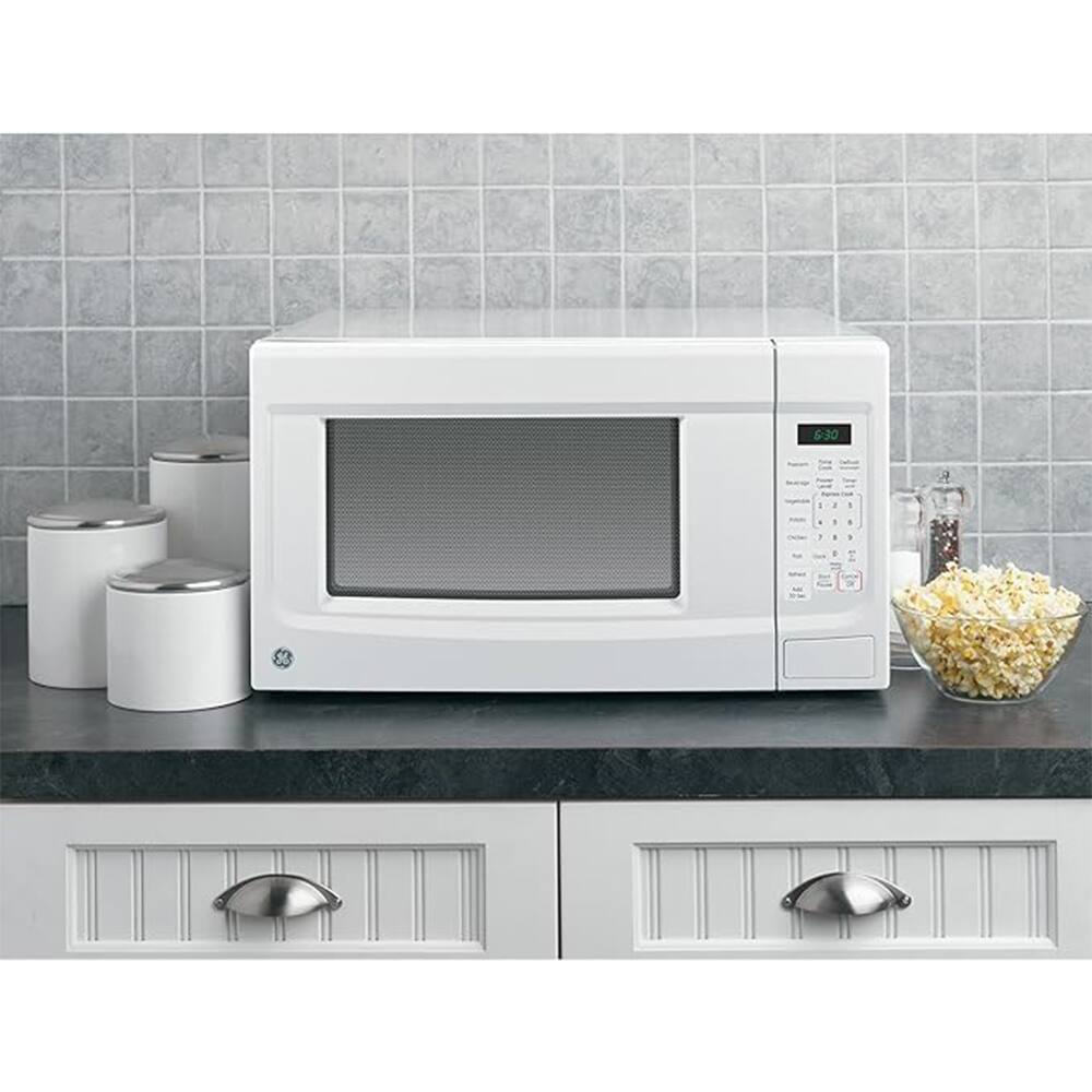 Back. GE - 1.4 Cu. Ft. Capacity Countertop Microwave Oven White + 2 Year Extended Warranty Protection Bundle - White.