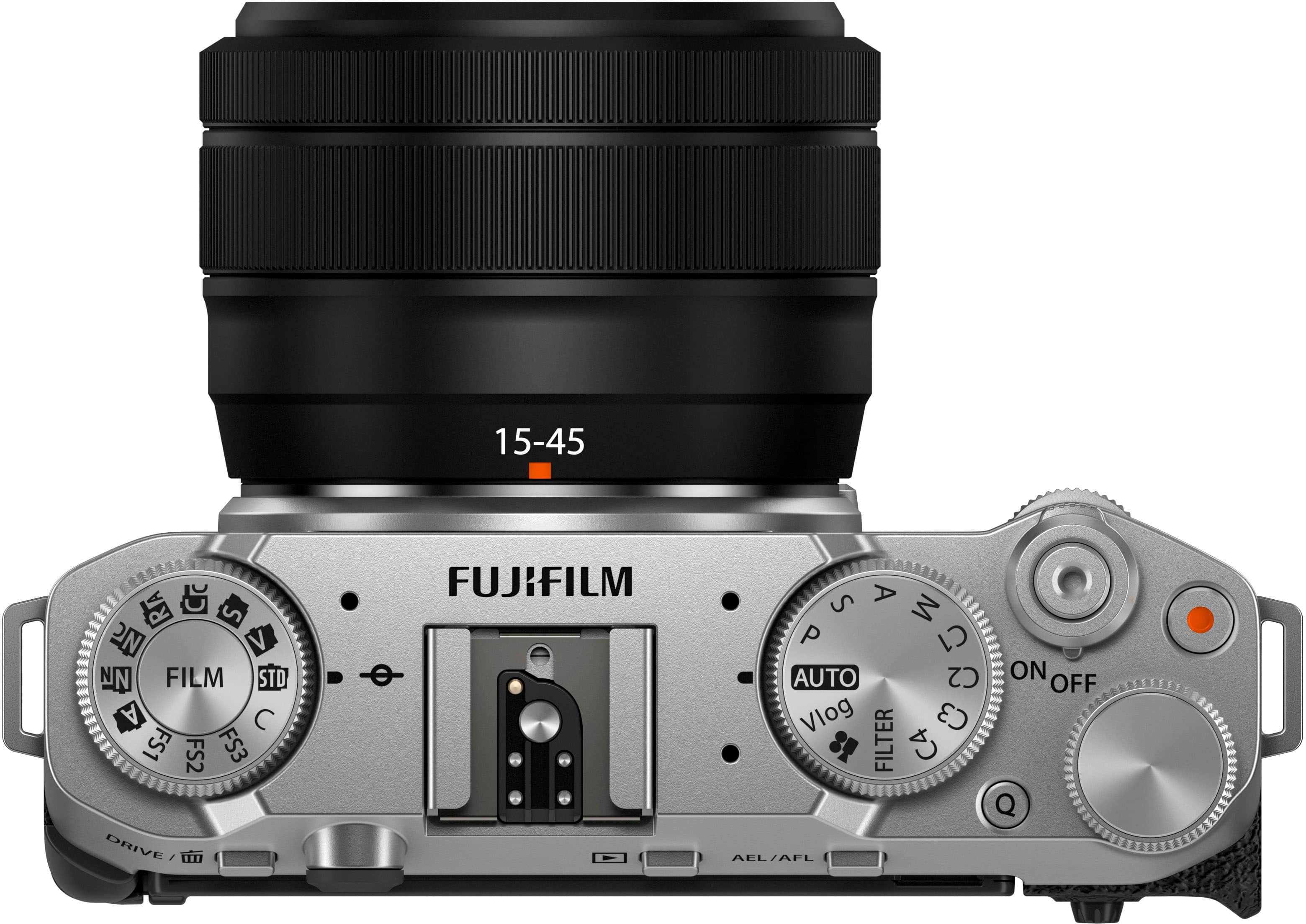 The text on the image reads: "15-45 RIA C S N V NN FILM STD A C FS1 FS2 FS3 DRIVE FUJIFILM S A a M P AUTO C2 ON OFF Vlog C3 FILTER C4 Q AEL/AFL." This is a description of a camera, likely a Fujifilm camera, with various features and settings.