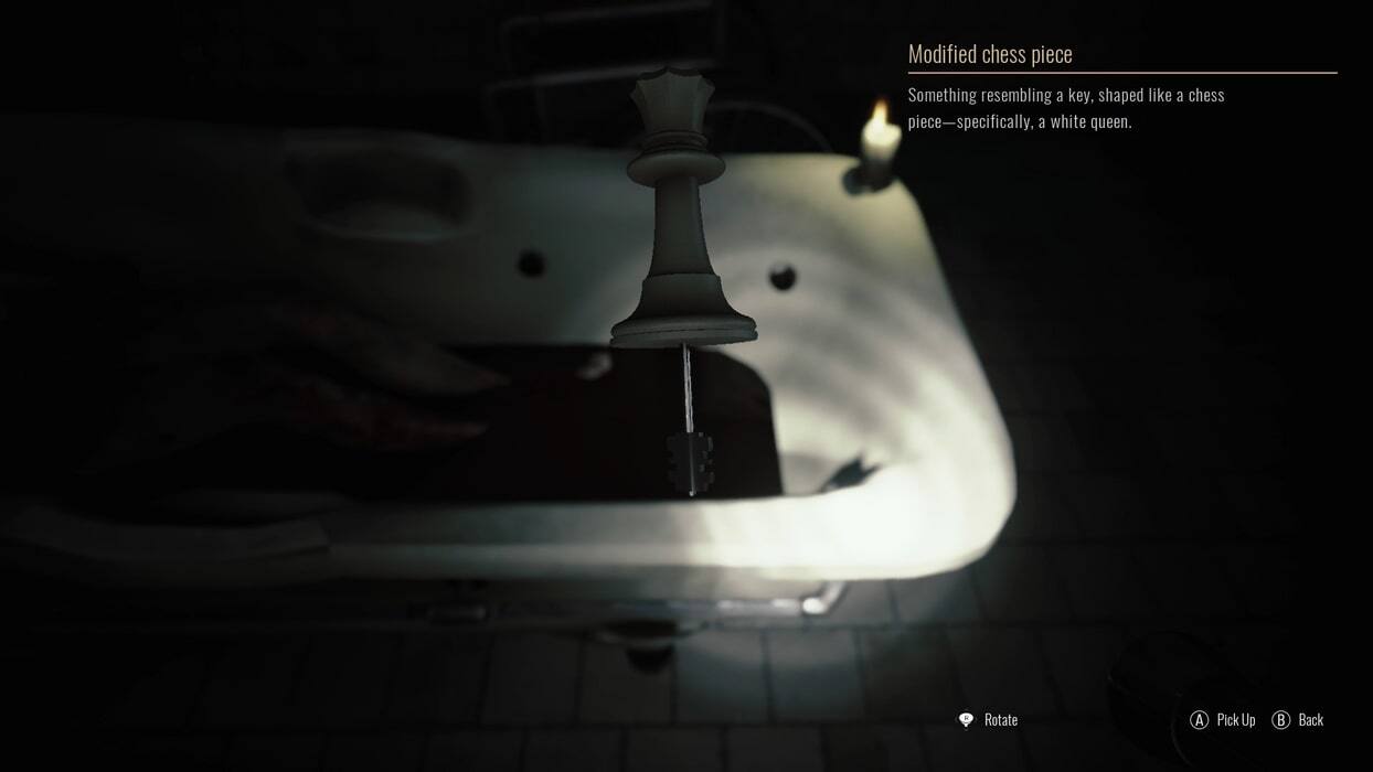 Modified chess piece  
Something resembling a key, shaped like a chess piece—specifically, a white queen.  

Rotate  
Pick Up  
Back