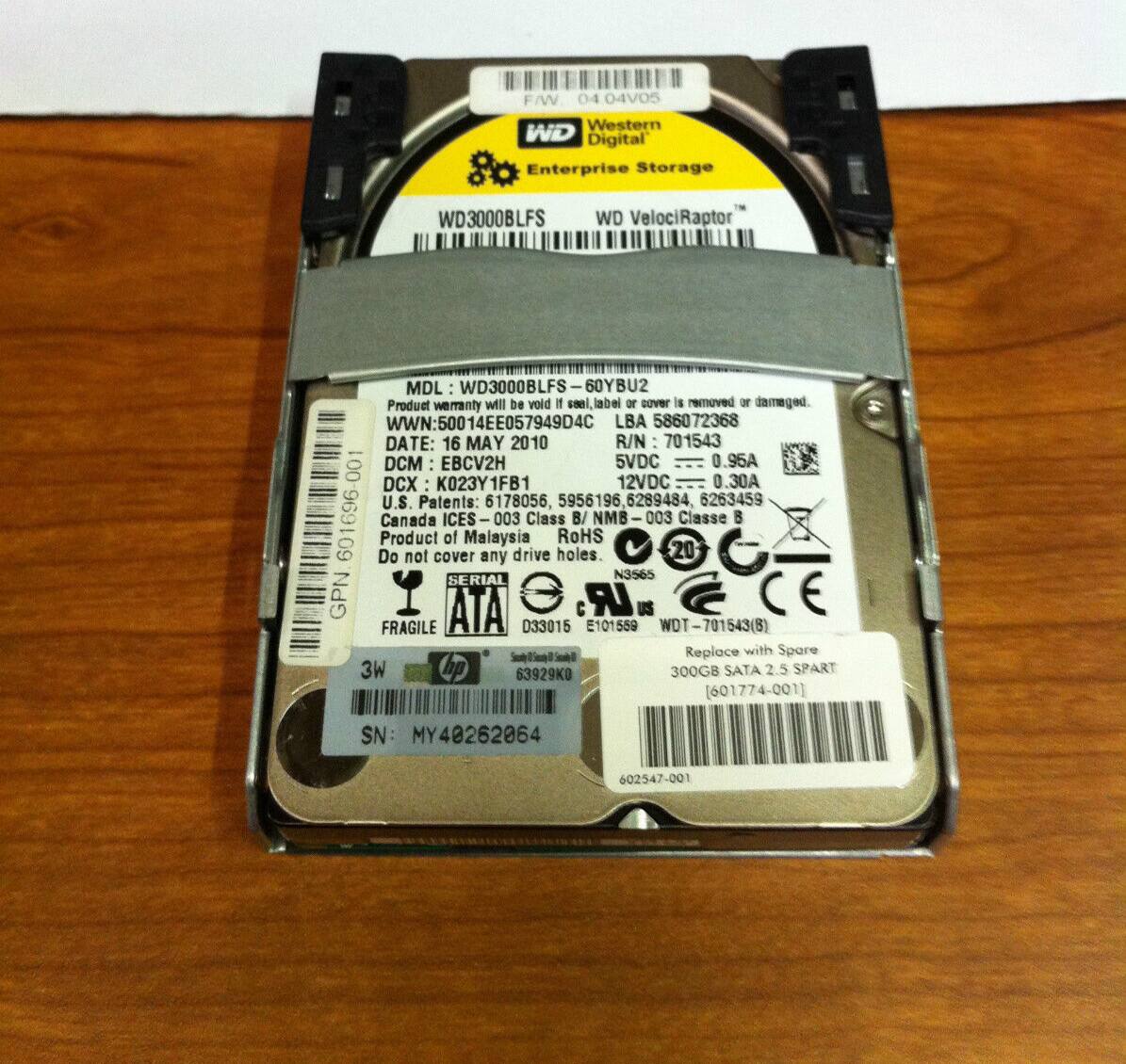 F/W 04 04VOS  
Western Digital Enterprise Storage  
WD VelociRaptor  
MDL: WD3000BLFS  
I 60YBU2  
Product warranty will be void if seal, label or cover is removed or damaged.  
WWN: 50014EE057949D4C  
LBA 586072368  
DATE: 16 MAY 2010  
R/N: 701543  
DCM: EBCV2H  
DCX: K023Y1FB1  
U.S. Patents: 6178056, 5956196, 6289484, 6263459, 601696  
Canada ICES 1 003 Class B/NMB 003 Classe B  
Product of Malaysia  
Do not cover any drive holes.  
20 SERIAL N3565  
GPN ATA LR  
FRAGILE 033015  
E101559  
WDT 701