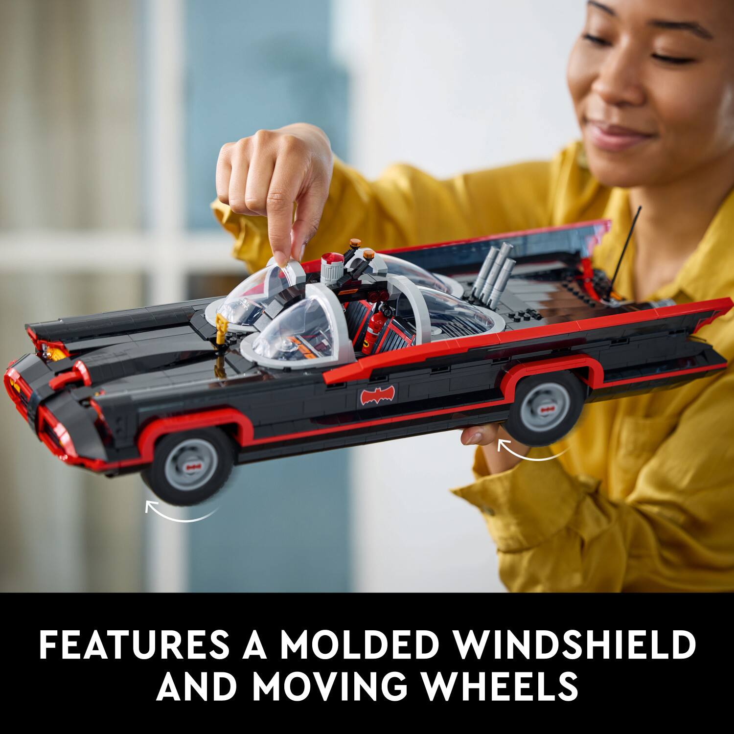 Features a molded windshield and moving wheels.