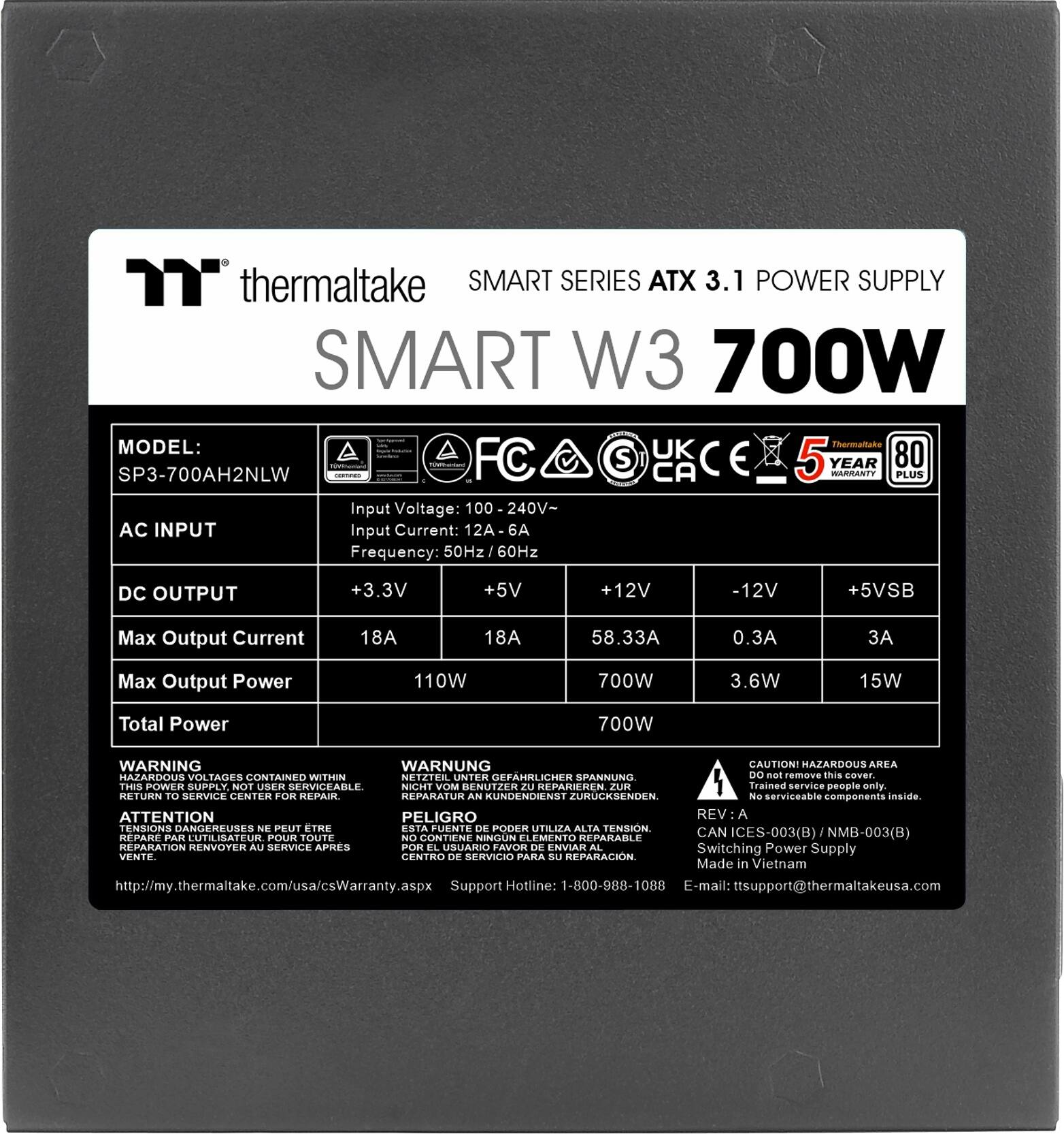 The image features a black box with a label that reads "Thermaltake SMART SERIES ATX 3.1 POWER SUPPLY SMART W3 700W." The box is designed to provide power to a computer system. The label also includes a warning that the power supply is not user serviceable and should only be handled by trained service personnel. The box is designed to contain high voltage and should not be tampered with. The box is also marked with a caution sign, indicating that it contains hazardous materials. The box is intended to be returned to a service center for repair.