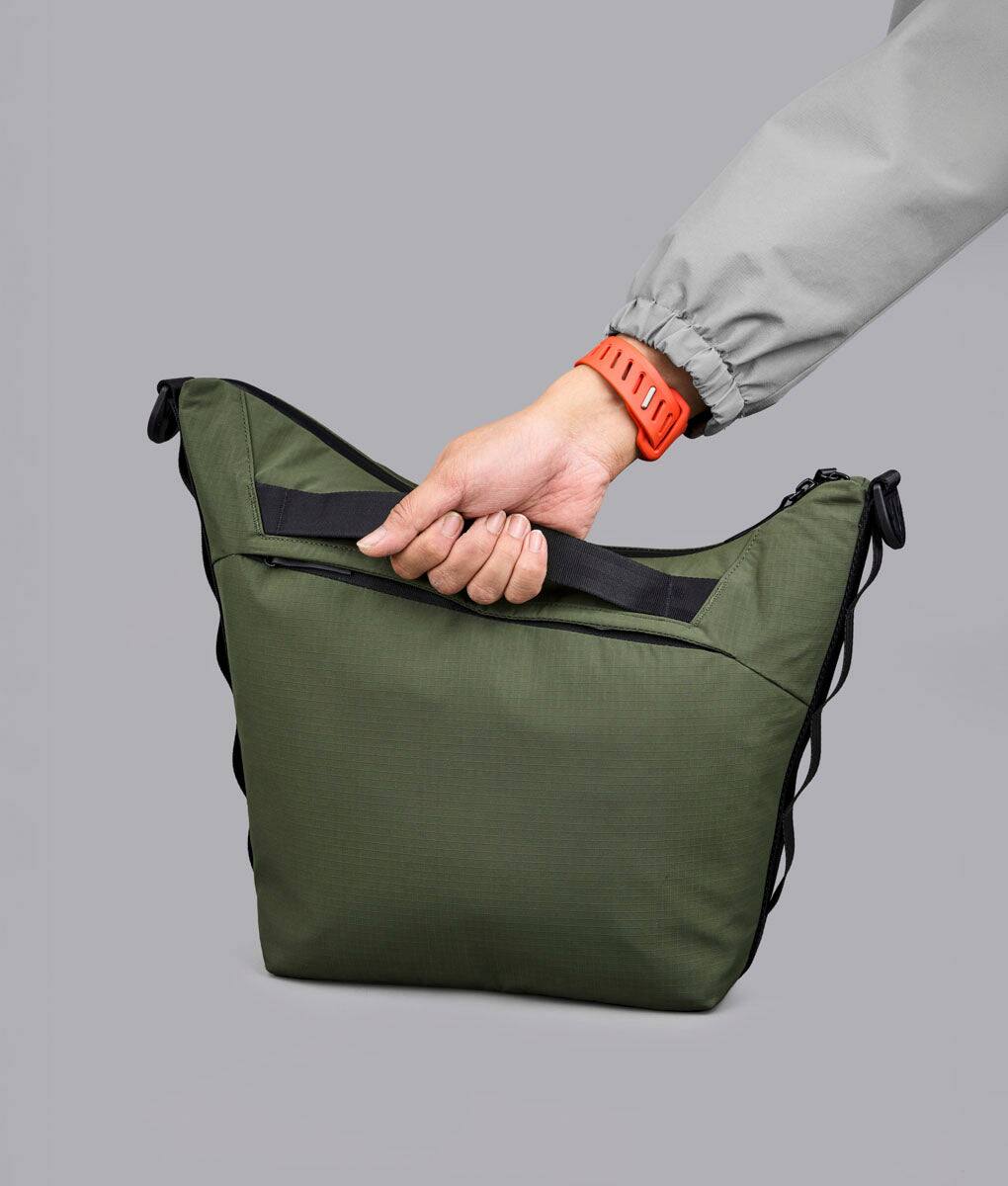 Angle. ALPAKA - Flow Satchel 10L Shoulder Bag for 13" Laptop with Water Bottle Holder - Green.