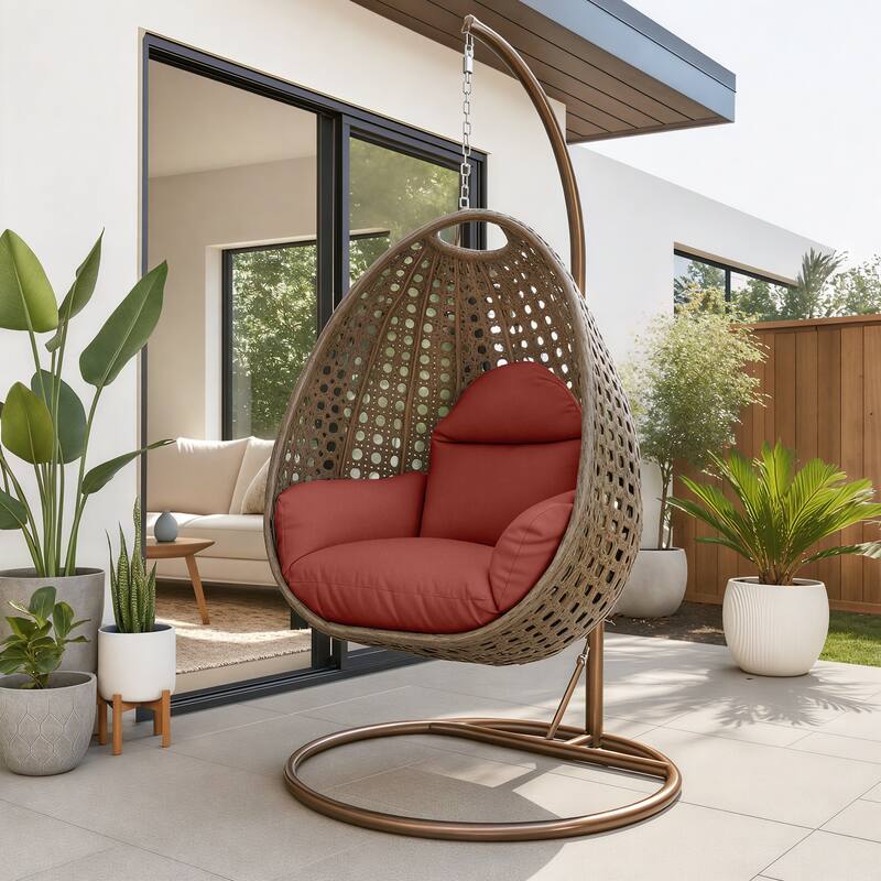 Angle. LeisureMod - LeisureMod Beige Wicker Hanging Egg Chair with Iron Stand & Cushion - All-Weather Single Outdoor Patio Swing - Cherry.