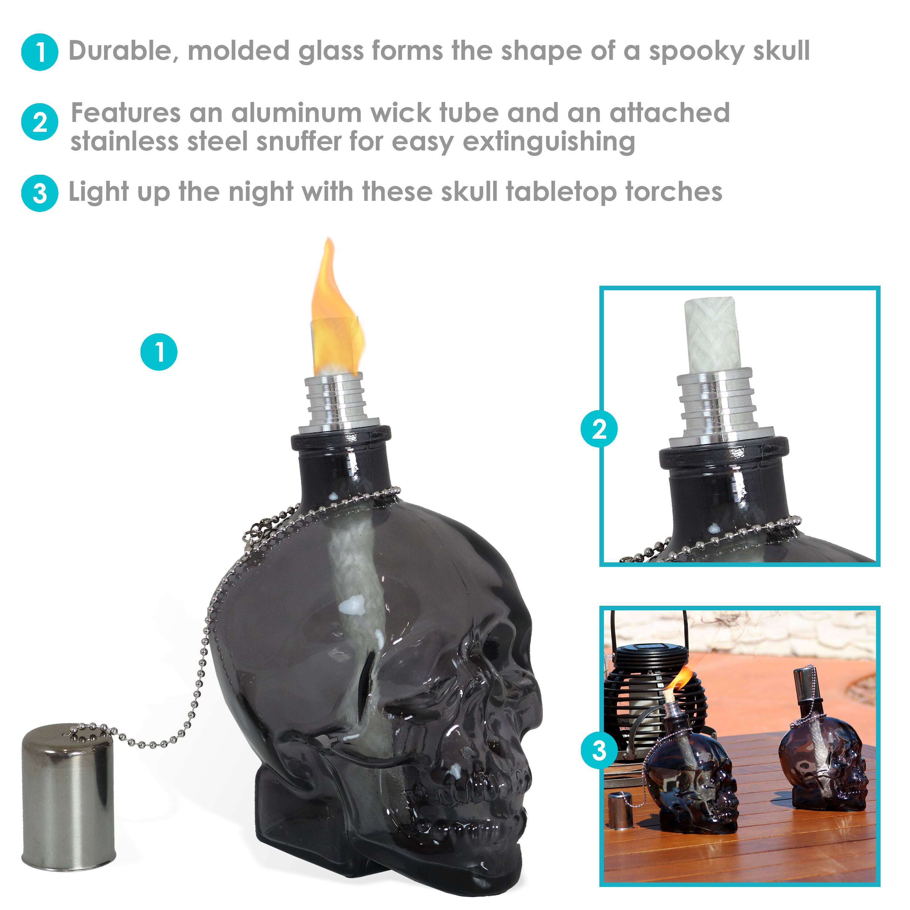 1. Durable, molded glass forms the shape of a spooky skull.
2. Features an aluminum wick tube and an attached stainless steel snuffer for easy extinguishing.
3. Light up the night with these skull tabletop torches.