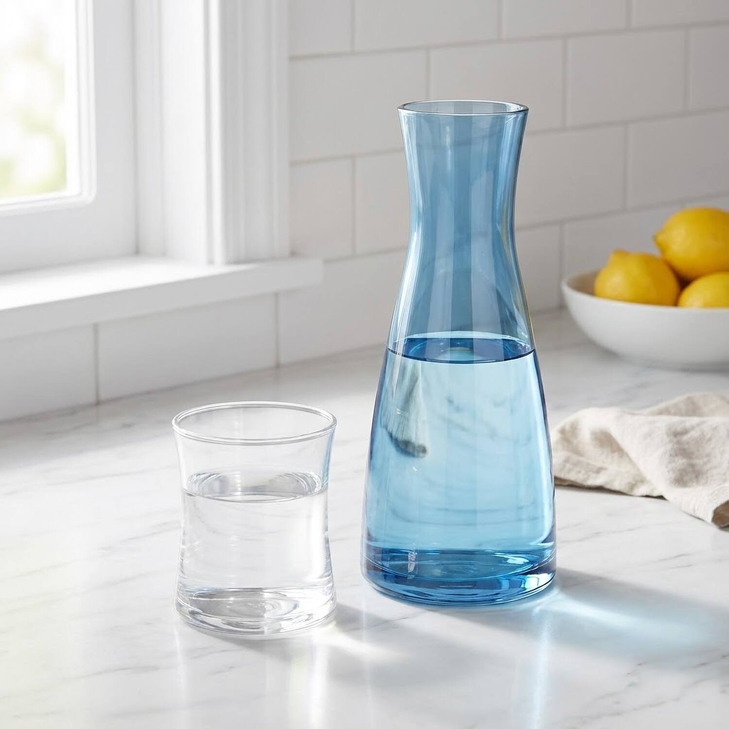 Left. American Atelier - Bedside Blue Carafe with Clear Tumbler, 2-Piece Set 33.82 OZ. - Blue.