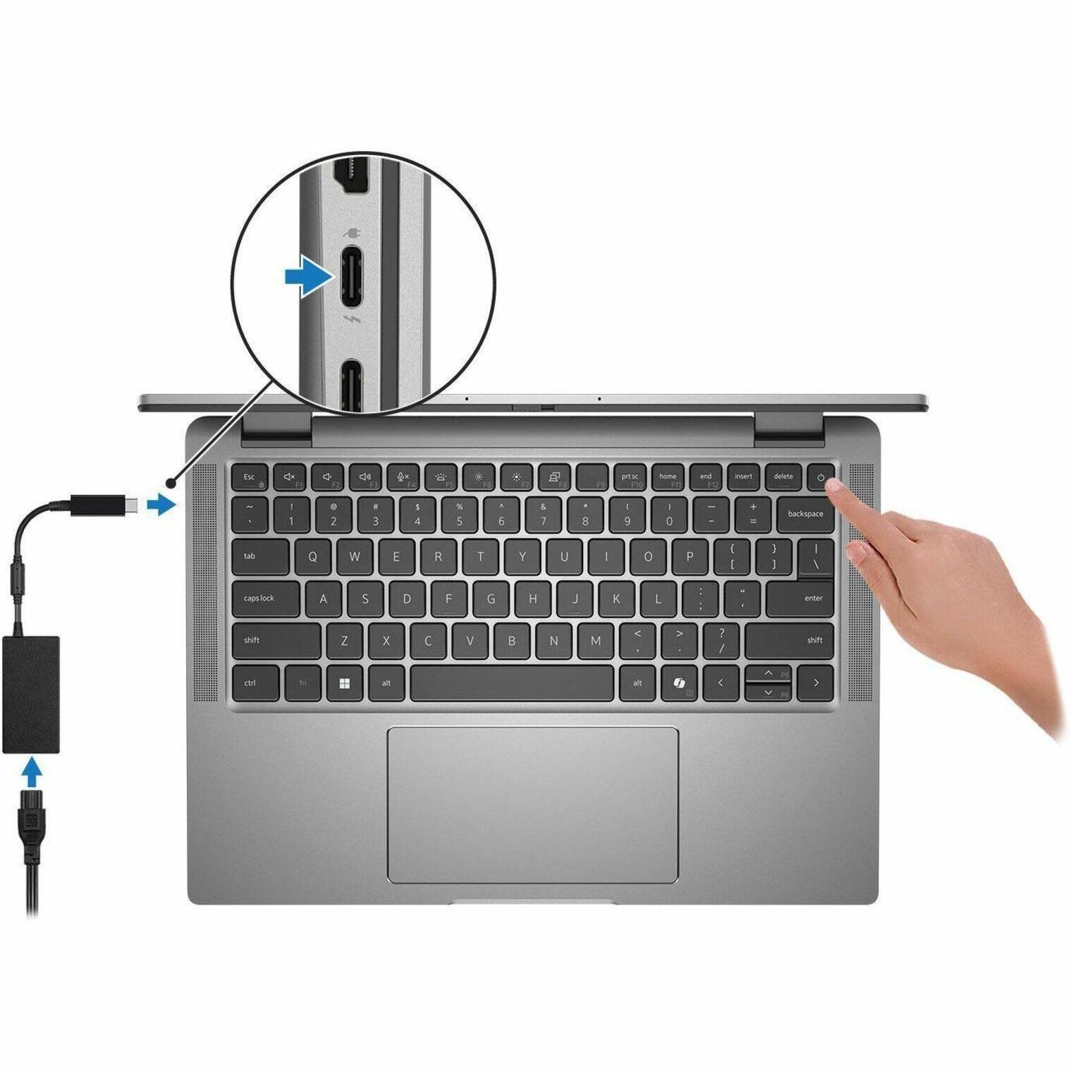 The image shows a laptop computer with a keyboard and a mouse. The laptop is open, and a hand is pointing at the keyboard. The keyboard has a USB plugged into it, which might be used for data transfer or charging purposes. The laptop is likely being used for work or personal tasks, and the hand pointing at the keyboard suggests that the user is focused on the keyboard or typing.