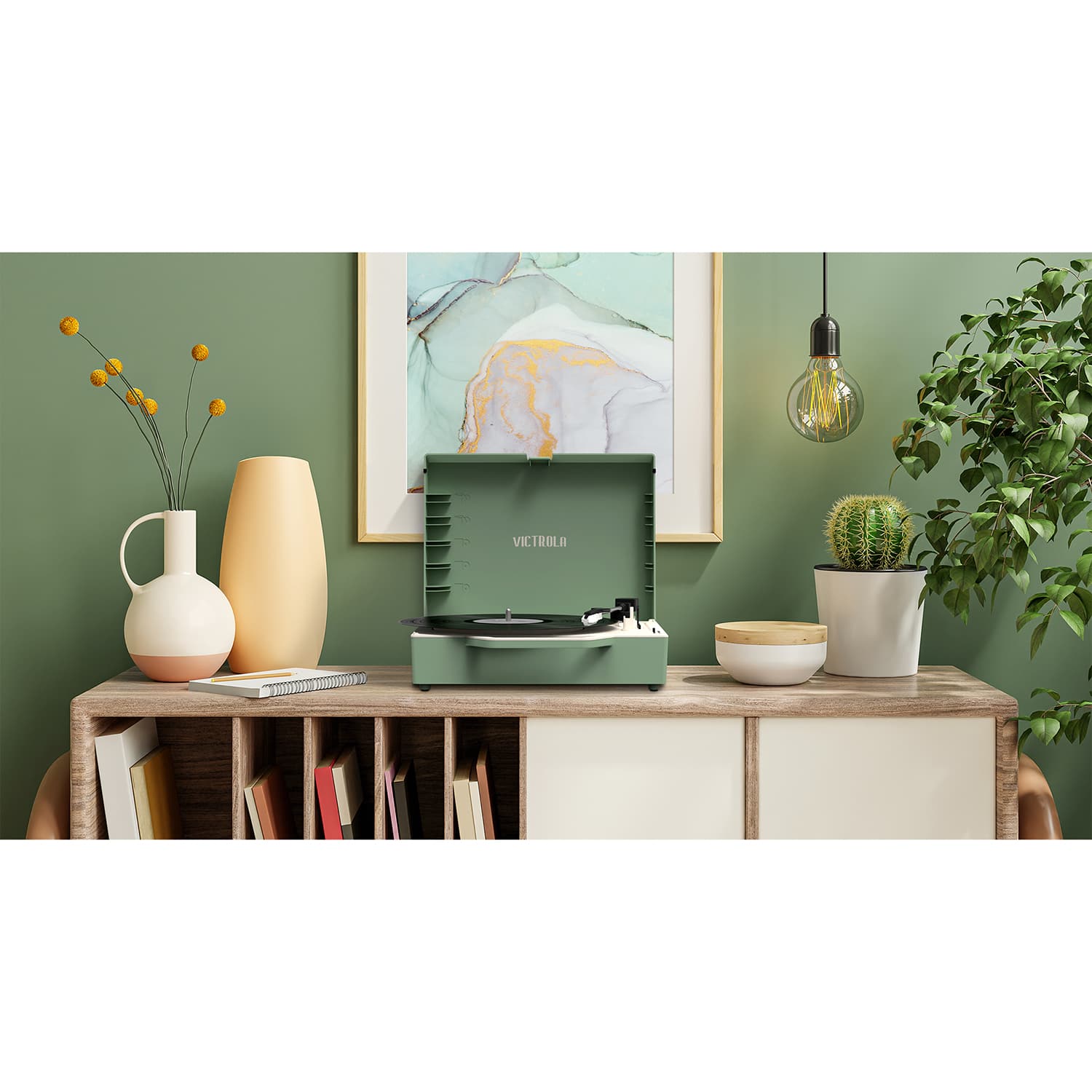 Alt View Zoom 26. Victrola - Re-Spin Sustainable Bluetooth Suitcase Record Player - Basil Green.