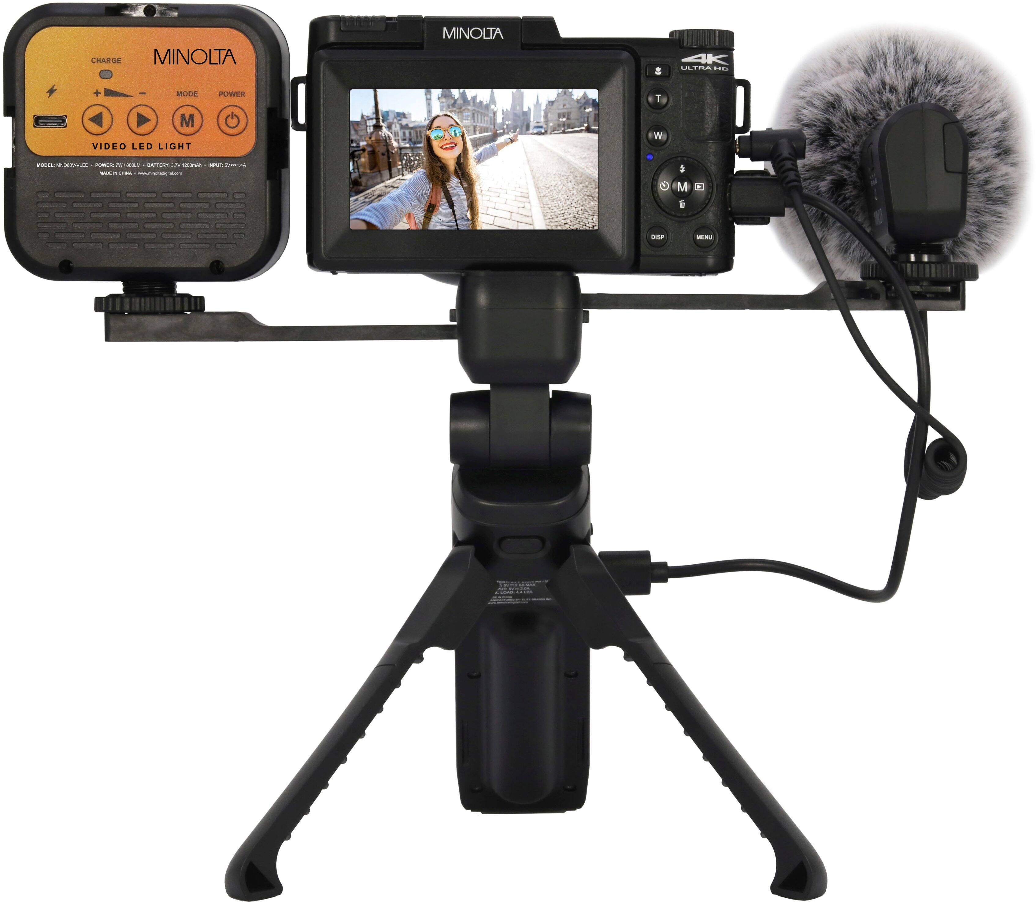 The text on the image reads "MINOLTA MINOLTA & 4K ETO.. MUDE POWER 1 M VIDEO LED LIGHT - -a - k - -  I - : : - 4 M I -- |".