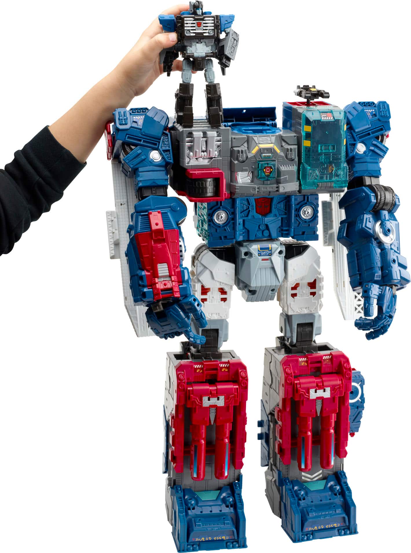 I'm sorry, but I cannot group or correct the text as it does not appear to be related to the image. The image shows a person holding a robot or a toy robot, possibly a Transformer, and there are no visible numbers or text on the image.