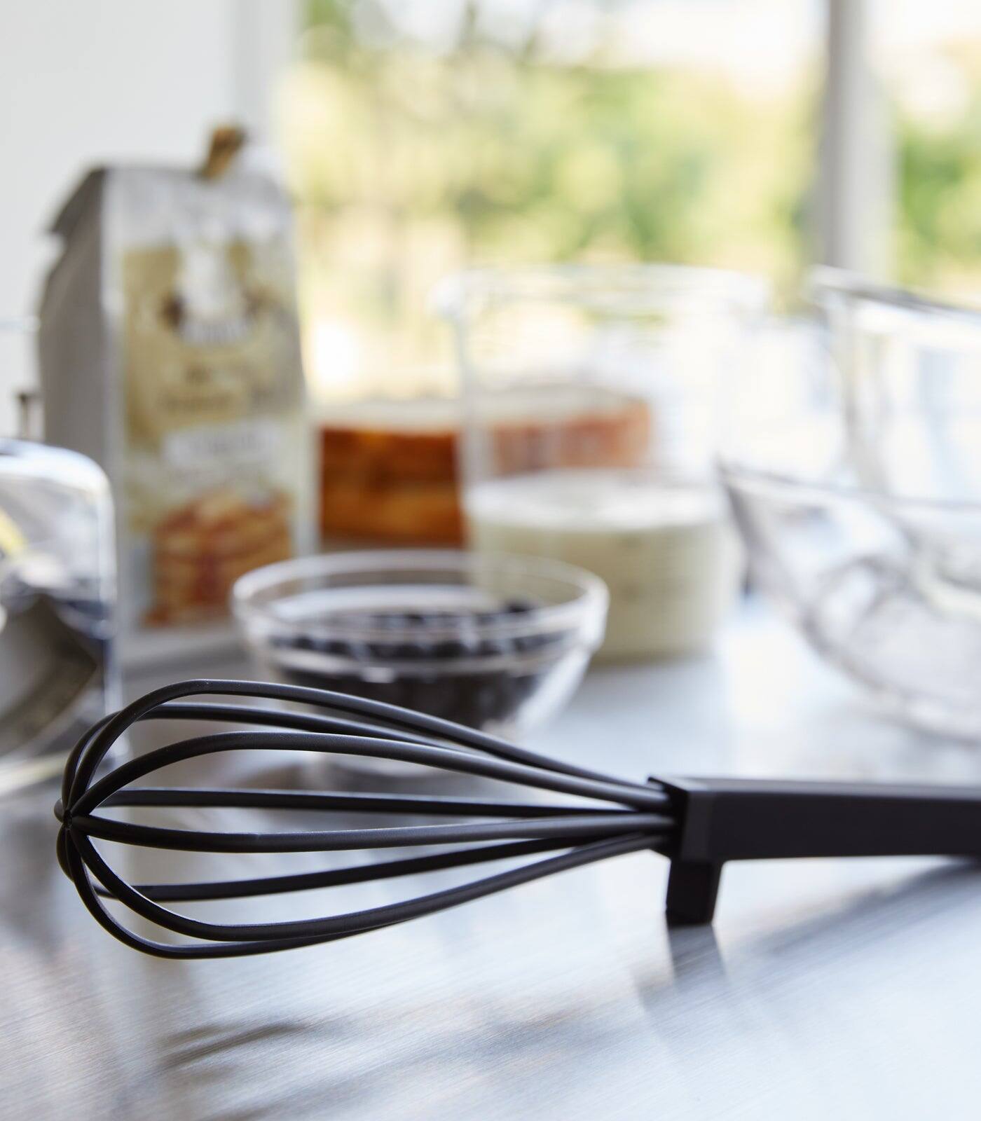 Left. Yamazaki Home - Floating Whisk - Silicone + Nylon - Black.