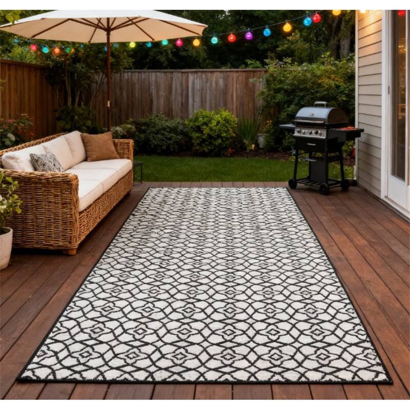 Angle. HTUTWOO - 9' x 18 Patio Reversible Outdoor Rug - RV Camping Carpet with Carry Bag, Mud-Resistant Fade-Proof, Foldable Portable Mat - Black White.