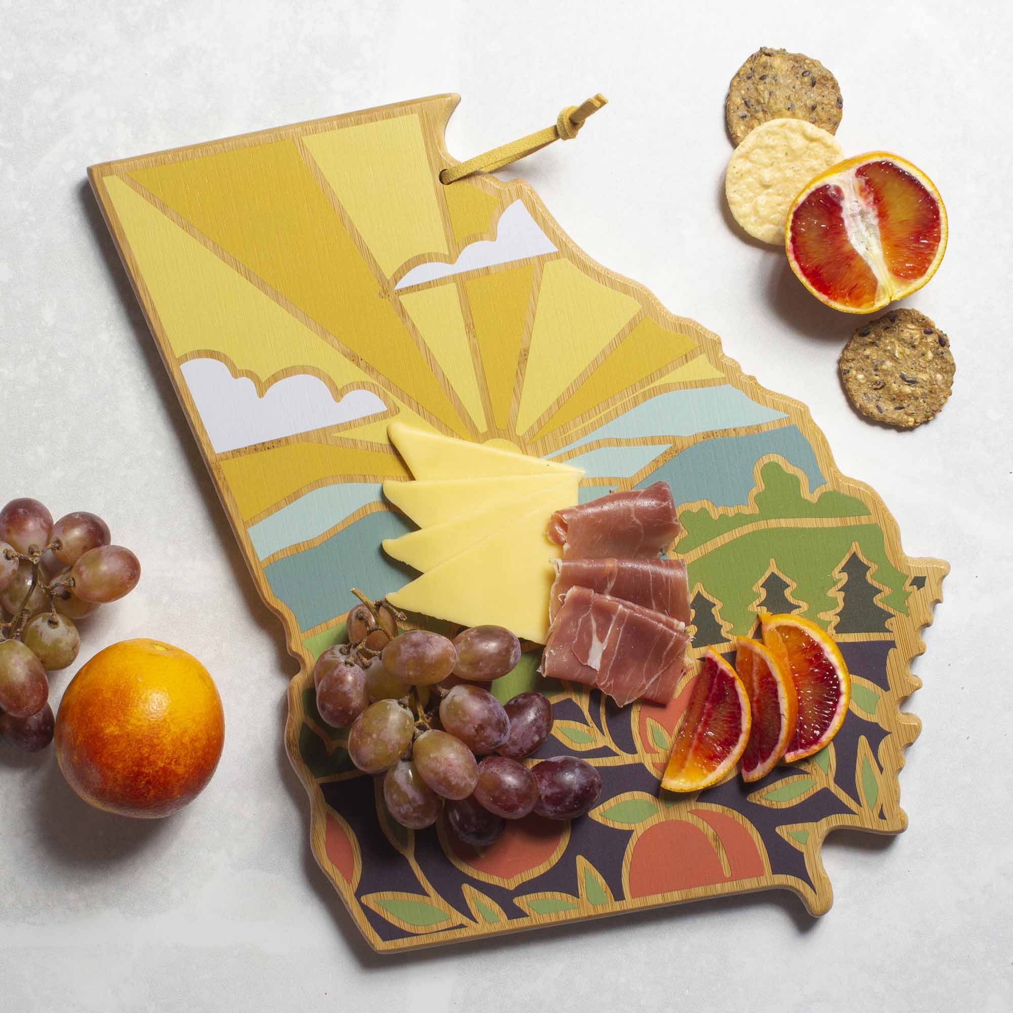 Angle. Totally Bamboo - Georgia Cutting Board with Artwork by Summer Stokes.