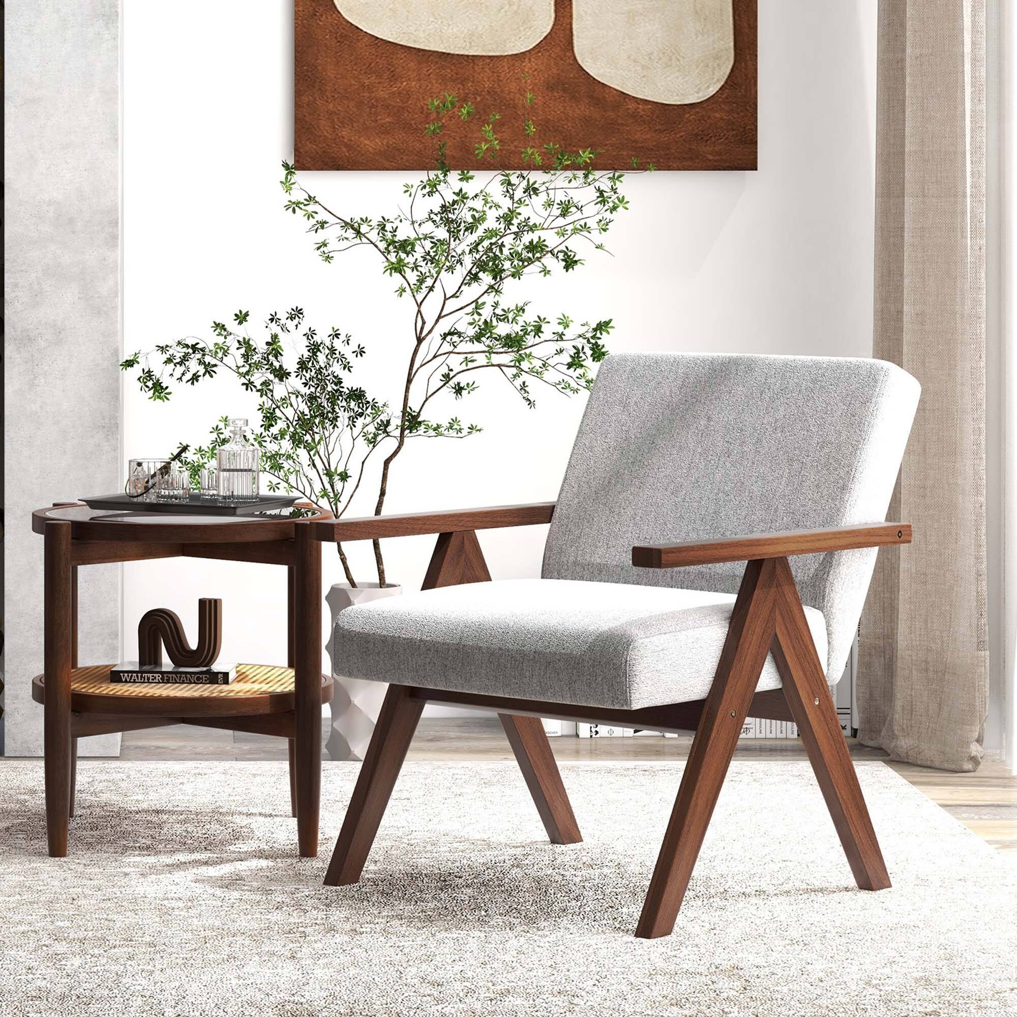 The image shows a living room with a chair, table, and a potted plant. The chair is positioned in front of the table, which has a book on it. The potted plant is placed next to the chair, adding a touch of greenery to the room. The living room is decorated with a painting on the wall, and the overall atmosphere appears to be cozy and inviting.