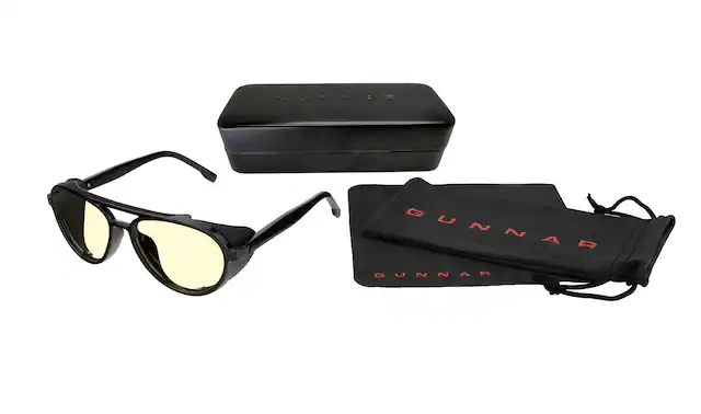 Gunnar is a brand that specializes in eyewear, offering sunglasses and prescription glasses. The image features a pair of Gunnar sunglasses, which are known for their high-quality materials and stylish designs. The sunglasses are displayed alongside a black case, which is designed to protect the glasses when not in use. The case is made of durable materials and features the Gunnar logo, making it a practical and fashionable accessory for the sunglasses.