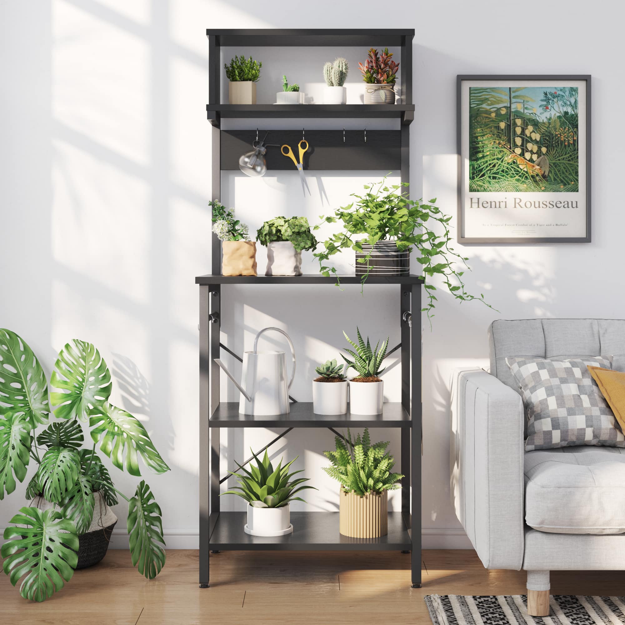 The image features a black shelf with several potted plants on it. There are a total of 12 potted plants, each with different sizes and shapes. The shelf is placed next to a couch, and a picture is hanging on the wall above the shelf. The plants are arranged in various positions on the shelf, creating a visually appealing display. The combination of the plants and the couch creates a cozy and inviting atmosphere in the room.