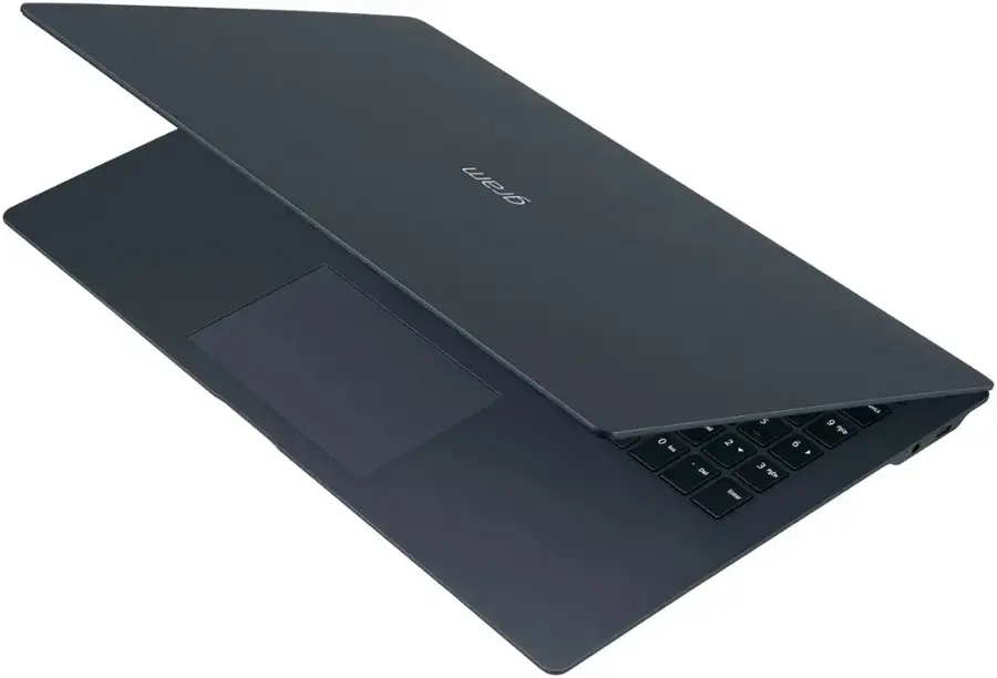 The text on the image is not in a coherent format, so it is not possible to group and correct it. However, I can provide you with a corrected version of the text based on the image description:

"A black laptop computer with a keyboard and a touchpad."