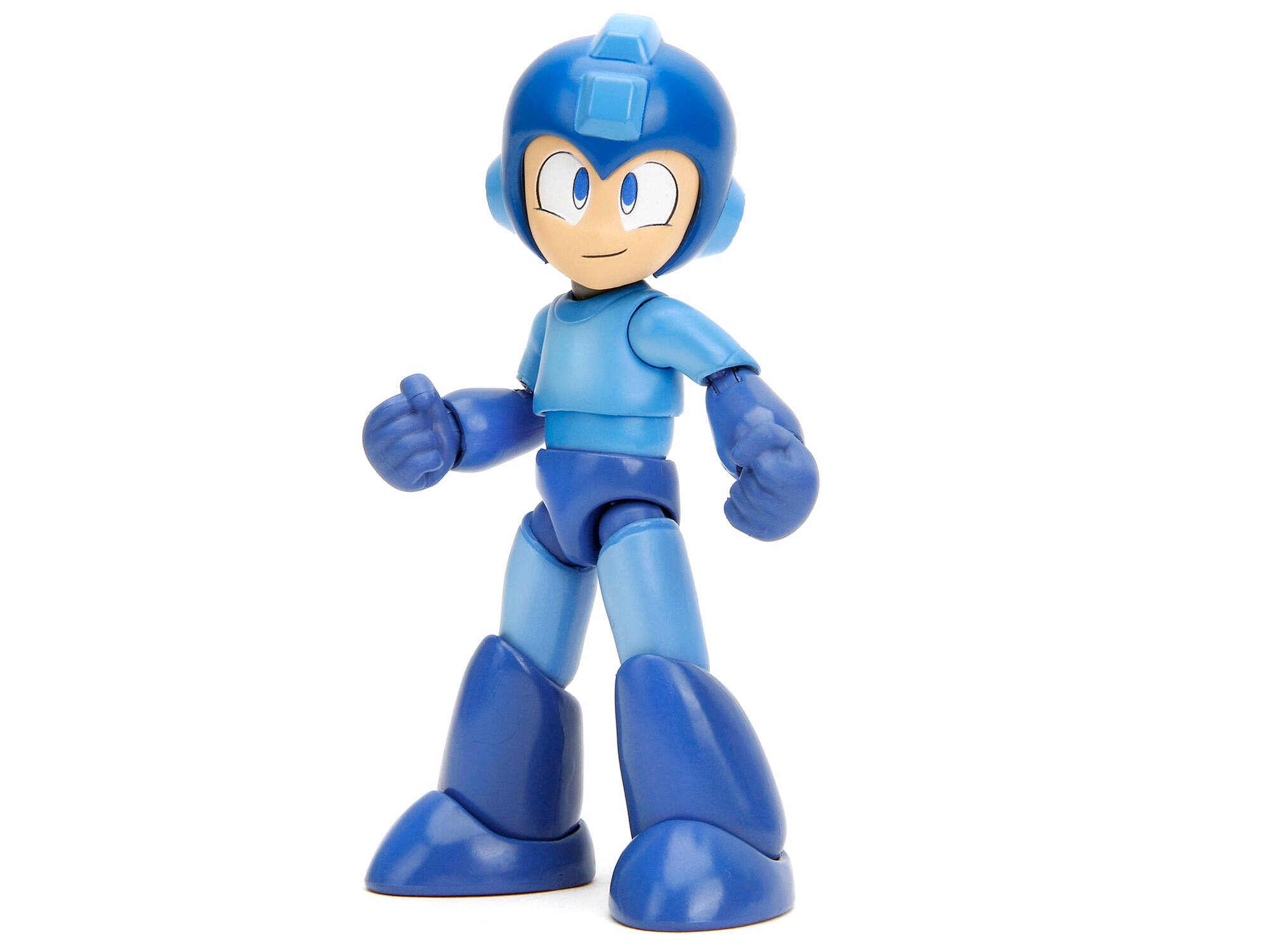 Angle. Jada - Mega Man 4.5" Moveable Figure with Accessories and Alternate Head and Hands "Mega Man" (1987) Video Game model by Jada - Blue.