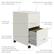 The image features a white filing cabinet with a Chrome Arc pull handle and a cam lock that secures both drawers. The cabinet has a smooth patented glide suspension and full high-side drawers that accommodate letter-size hanging file folders and other office essentials. Additionally, the cabinet has a three-quarter drawer extension to prevent tipping. The design is smart and efficient, making it suitable for smaller spaces, and the surface is durable and non-porous, painted with steel.