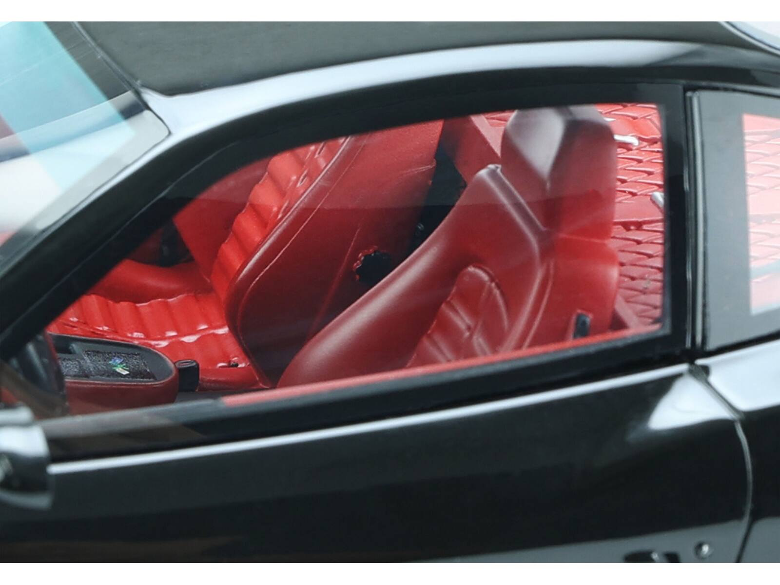 Left. GT Spirit - 1997 Ferrari 550 "Koenig Special" Black with Red Interior 1/18 Model Car by GT Spirit - Black with Red.