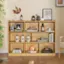 The image features a wooden shelf with various items on it, including books, bottles, and a vase. The shelf is placed in a room with a hardwood floor. The items on the shelf are arranged in a way that showcases their unique characteristics and adds visual interest to the space. The combination of books, bottles, and a vase creates a harmonious and aesthetically pleasing display, reflecting the homeowner's taste and style.