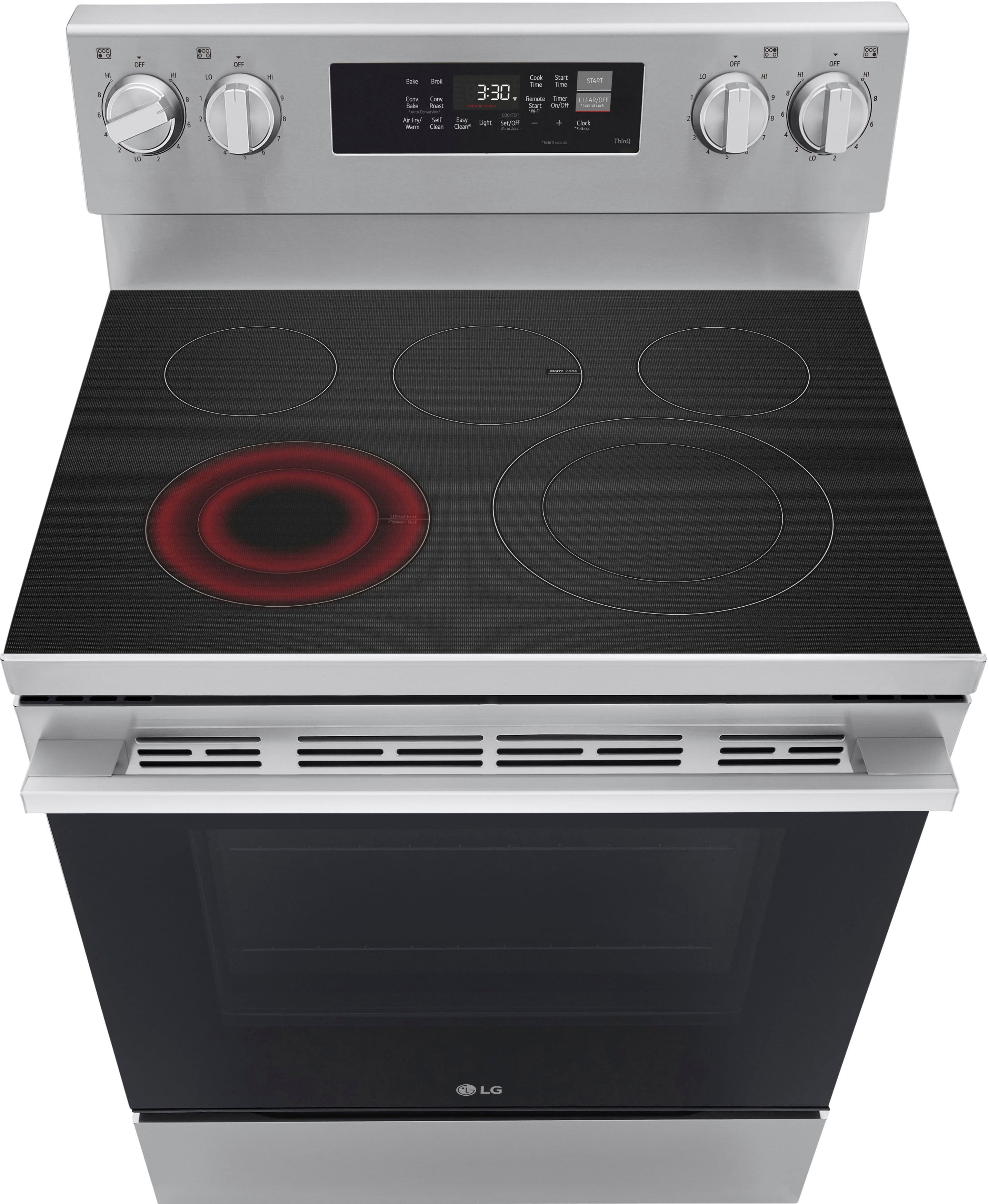 The image shows a stainless steel stove with a digital display showing the time as 3:30. The stove has a black background, and the oven is visible beneath the stove. The stove is part of an LG appliance set, which includes a microwave and an oven. The oven is located below the stove, and the microwave is positioned above the oven. The stove is a modern and sleek design, with a clean and minimalist appearance.