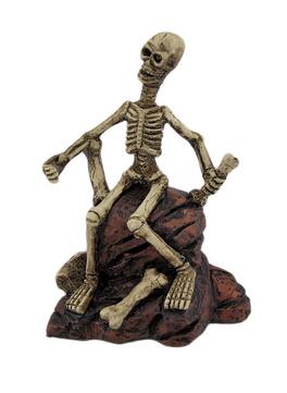 Zeckos - Creepy Skeleton Sitting On Rocks Statue Figure - Multicolored