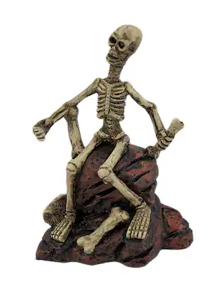 Front. Zeckos - Creepy Skeleton Sitting On Rocks Statue Figure - Multicolored.