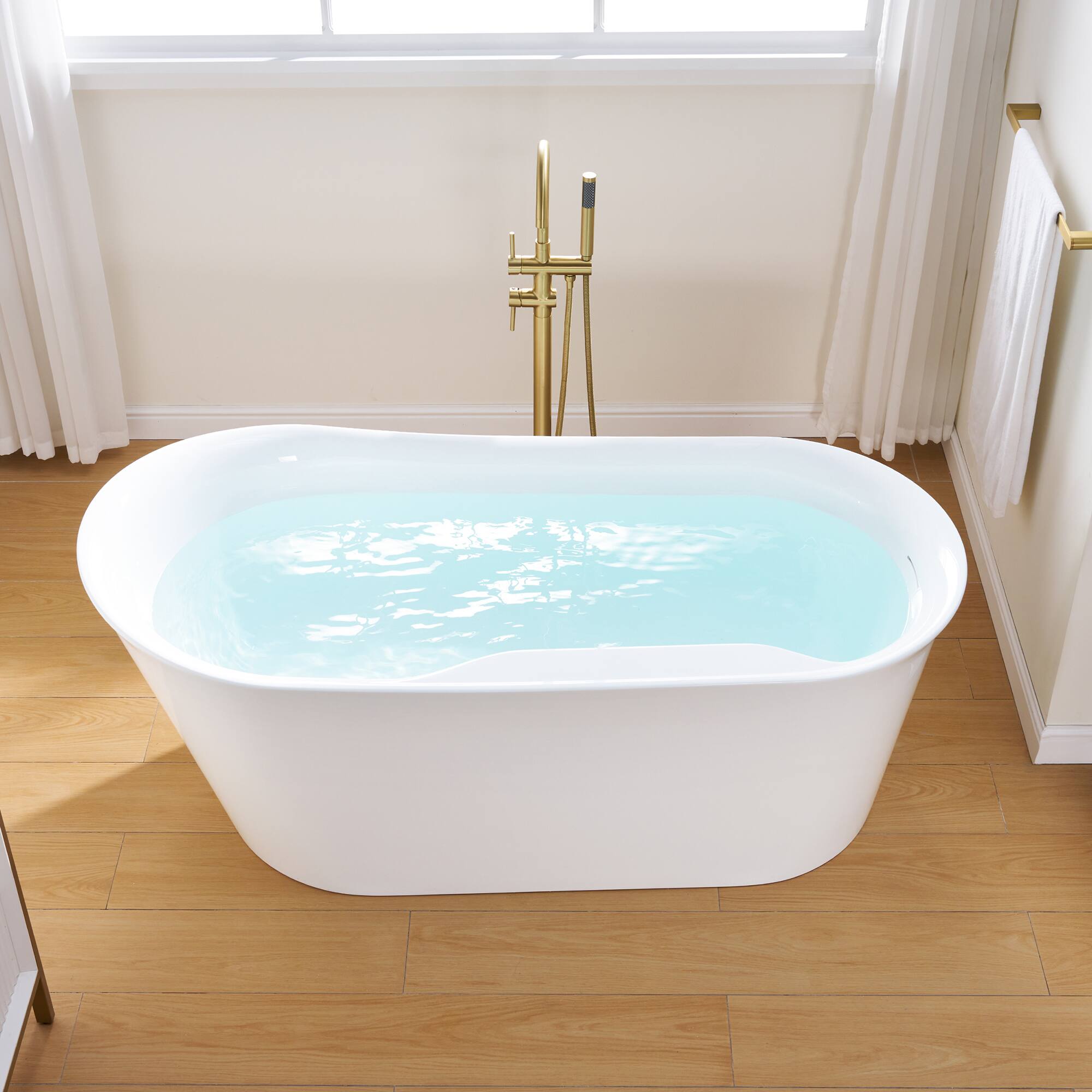 Left. WELLFOR - Silva 66 in. Acrylic Flat Bottom Double Ended Freestanding Soaking  Bathtub with Drain and Overflow - White.