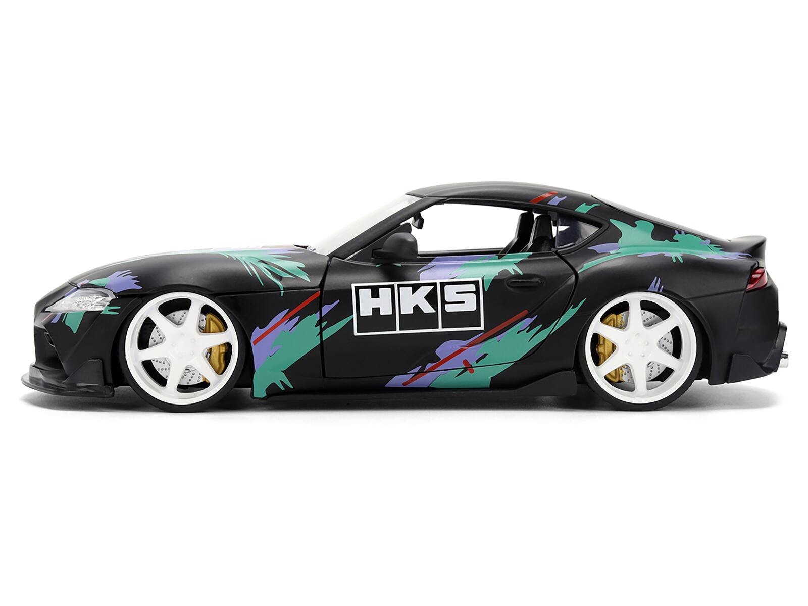 Left. Jada - 2020 Toyota GR Supra "HKS" Matt Black with Graphics "JDM Tuners" Series 1/24 Diecast Model Car by Jada - Matt Black with Graphics.