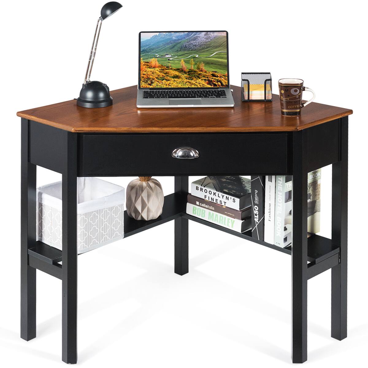 The image features a wooden desk with a laptop, a coffee mug, and a book. The book is titled "Brooklyn's Finest." There is also a cup on the desk. The desk is accompanied by a lamp, providing ample lighting for the workspace.