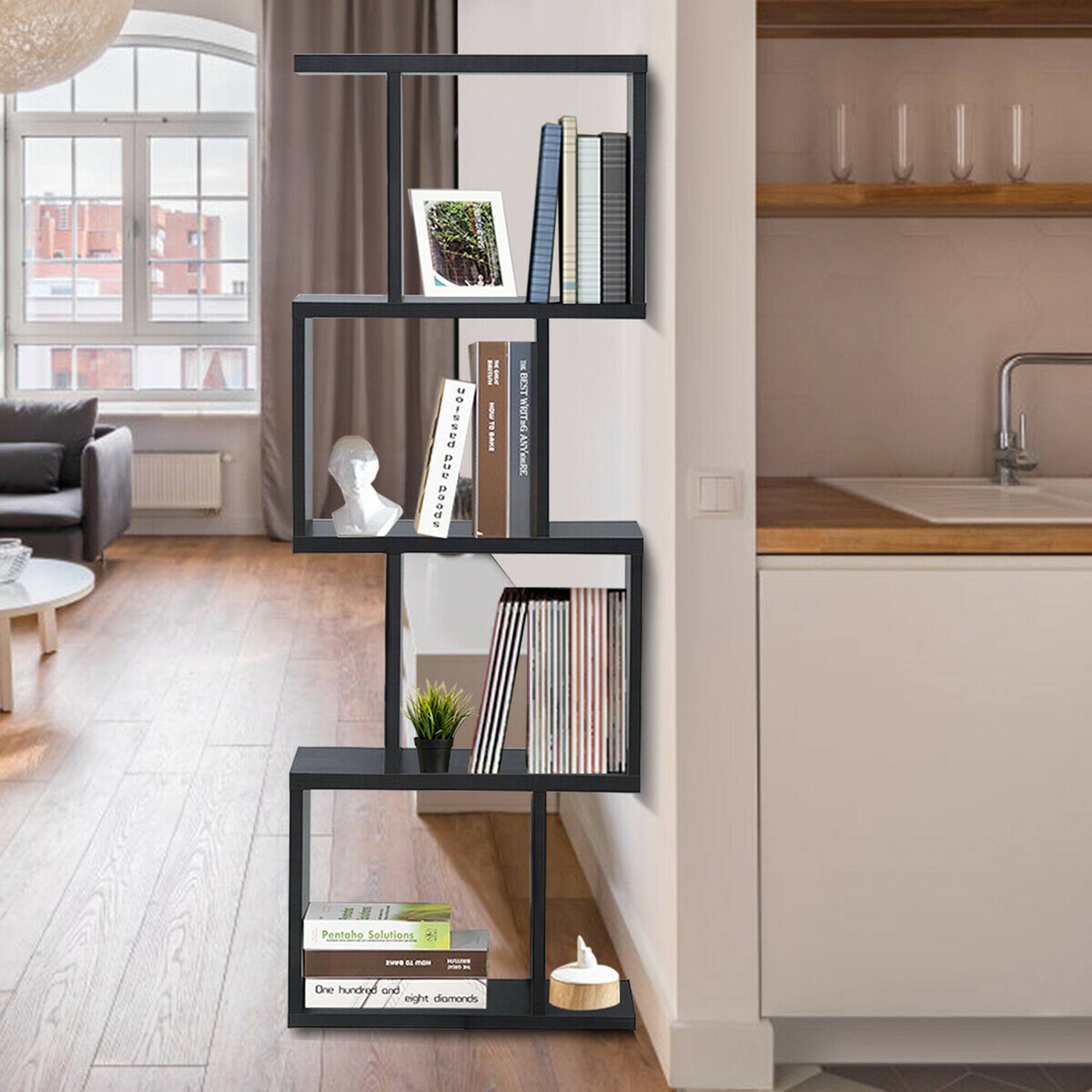 The image features a bookshelf with a variety of books and other items on it. The bookshelf is placed in a living room, and it is filled with books, magazines, and a vase. The books are arranged in different sections, and there are also some books placed on the floor. The bookshelf is a part of a modern home design, and it adds a touch of sophistication to the living space.