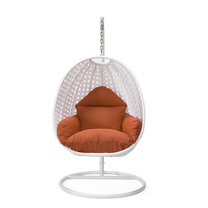 Left. LeisureMod - LeisureMod Modern Handwoven White Wicker Egg Swing Chair with Stand - Single Hanging Indoor/Outdoor Chair for Patio - Orange.