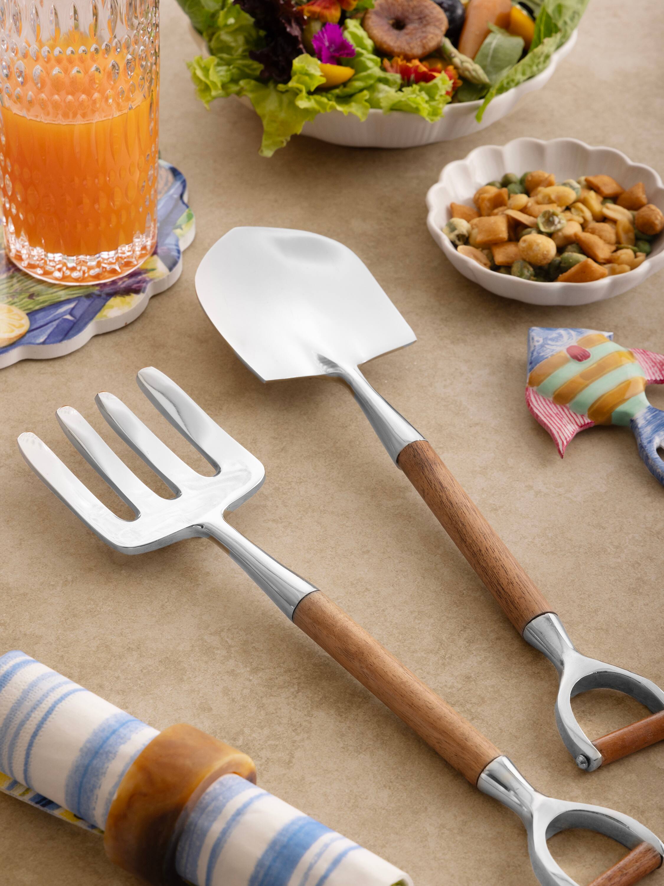 Left. GAURI KOHLI - Narvik Salad Servers - Brown, shiny steel.