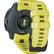 The watch is an Instinct watch with a yellow band and a green light. It has a black face and is designed for outdoor use. The watch is waterproof and has a GPS feature, making it suitable for various activities. The watch is also equipped with a compass and a thermometer, providing additional functionality for the user. The watch is designed to be durable and reliable, making it a great choice for outdoor enthusiasts.