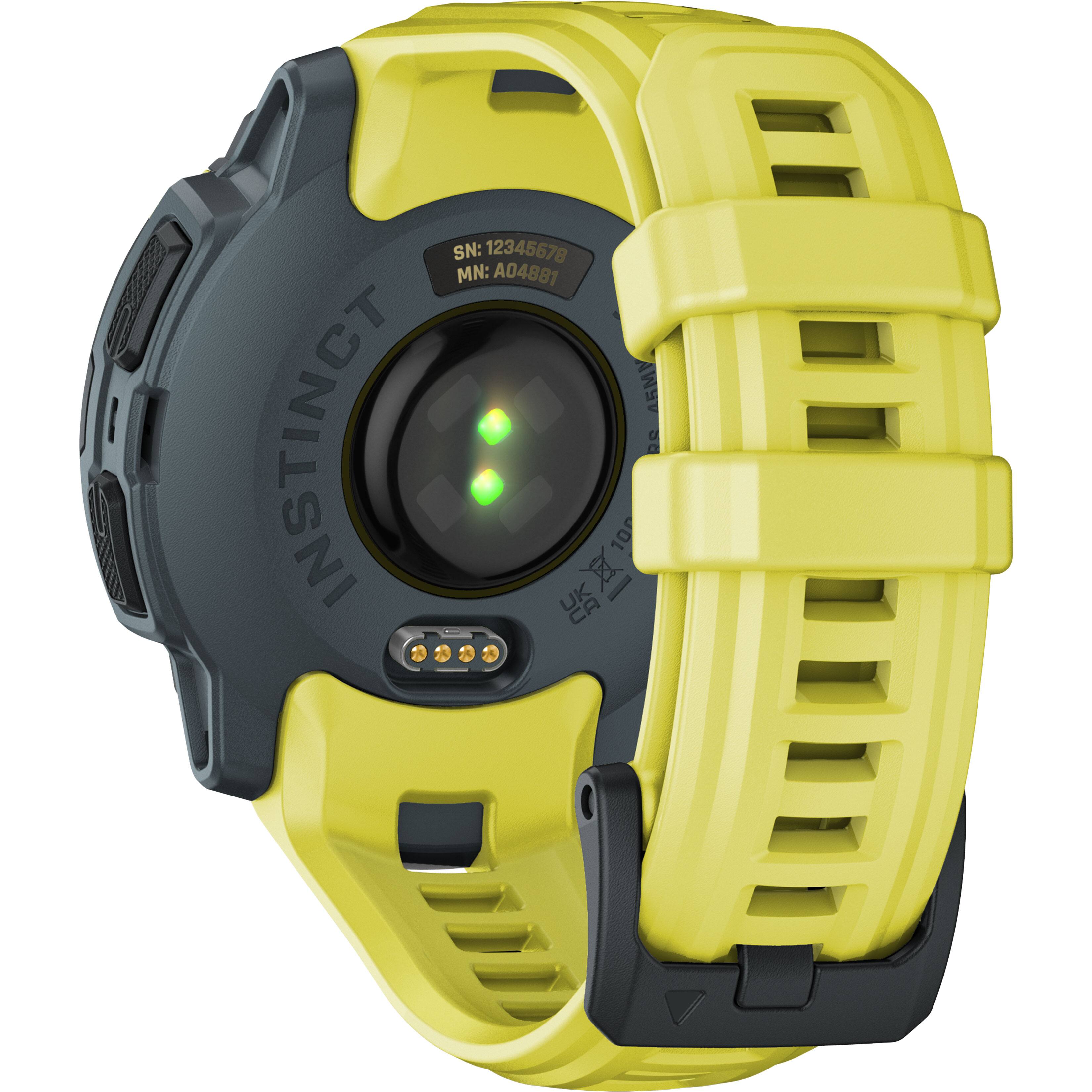 The watch is an Instinct watch with a yellow band and a green light. It has a black face and is designed for outdoor use. The watch is waterproof and has a GPS feature, making it suitable for various activities. The watch is also equipped with a compass and a thermometer, providing additional functionality for the user. The watch is designed to be durable and reliable, making it a great choice for outdoor enthusiasts.