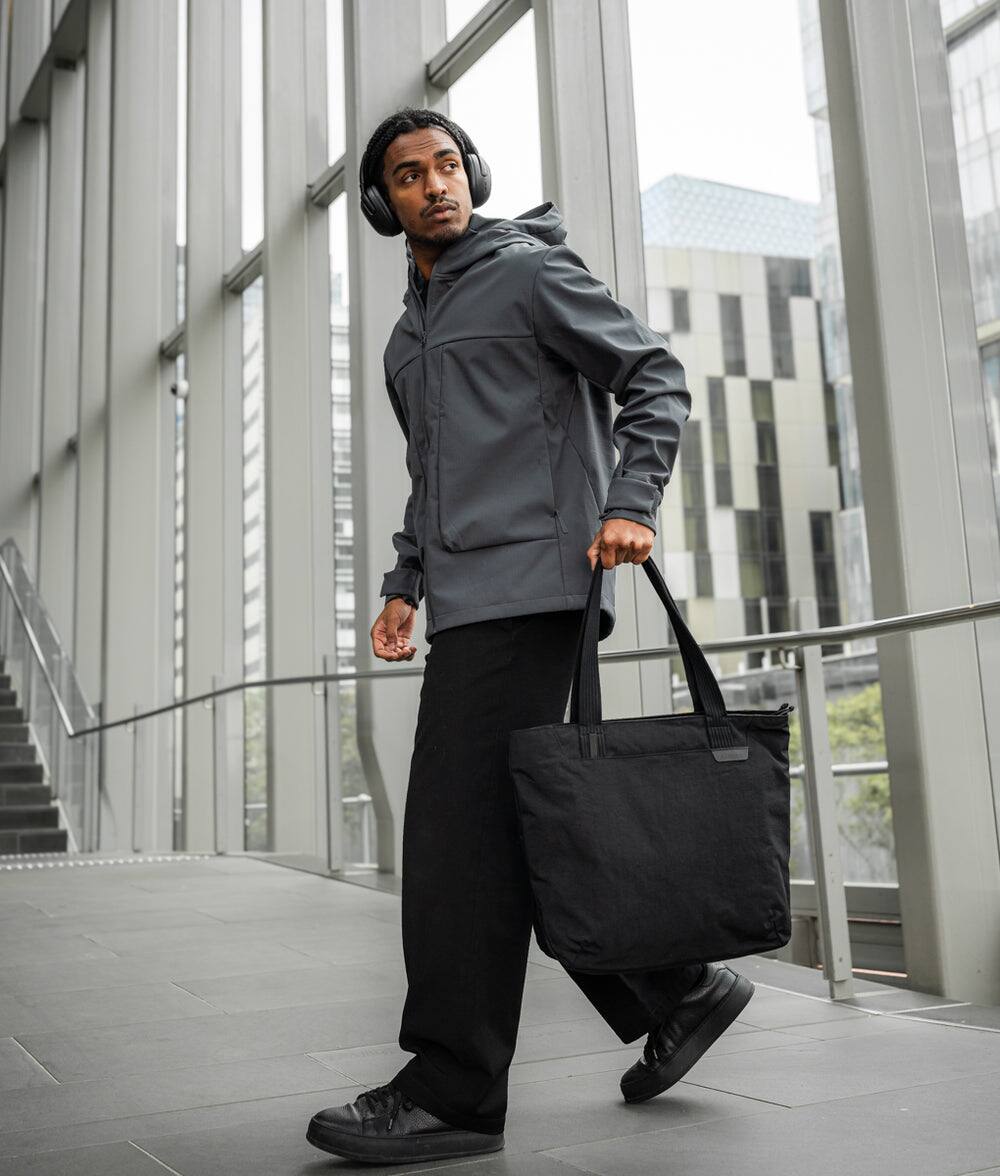 Alt View 9. ALPAKA - Flight Tote (L) Laptop Tote Bag for Work, Large Tote Bag Fits 16" MacBook Pro, Water Bottle Pocket, Luggage Pass-Through - Black Axoflux 400D.