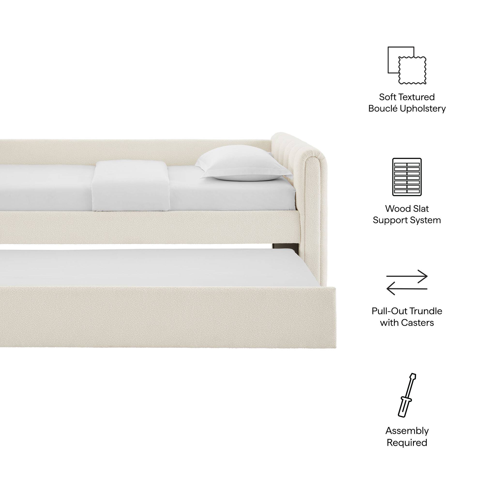 - Soft Textured Bouclé Upholstery
- Wood Slat Support System
- Pull-Out Trundle with Casters
- Assembly Required