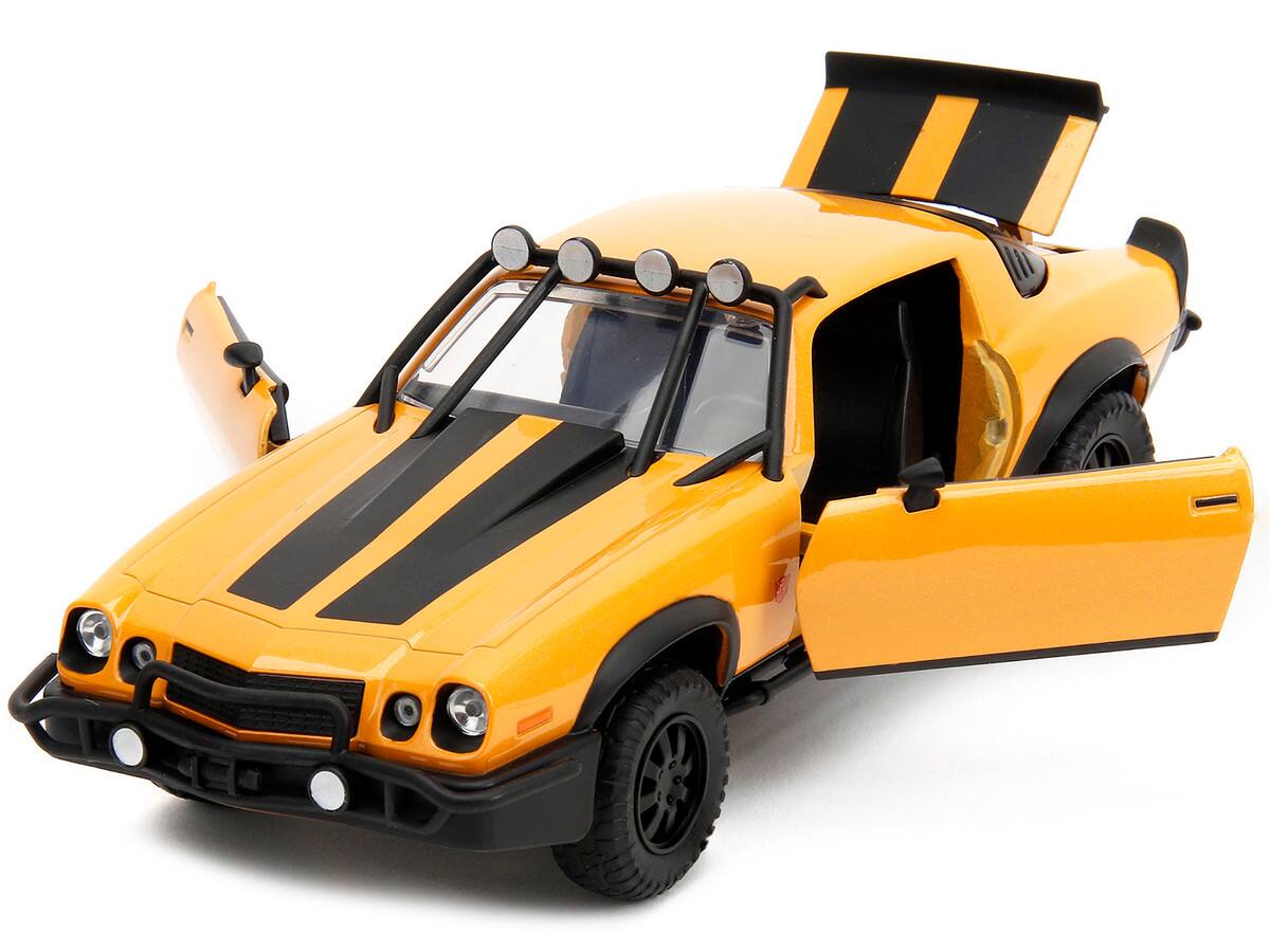 Angle. Jada - 1977 Chevrolet Camaro Off-Road Bumblebee Yellow w/ Black Stripes & Transformers Statue – Rise of the Beasts (2023) 1/24 - Yellow Metallic with Black Stripes.
