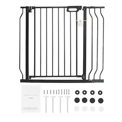 The image shows a black metal dog gate with vertical bars and a handle at the top. Below the gate, there are screws, bolts, and other hardware components laid out, along with a manual labeled "Dog Gate."