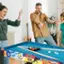 The text on the image reads "2 P 12181 6 GAMES FANL". This text is likely related to the pool table and may indicate the number of games played or the score.