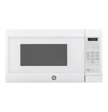 The image shows a white microwave with the time 1:01 displayed on the front. The microwave is made by Ge, and it is a small, compact appliance.