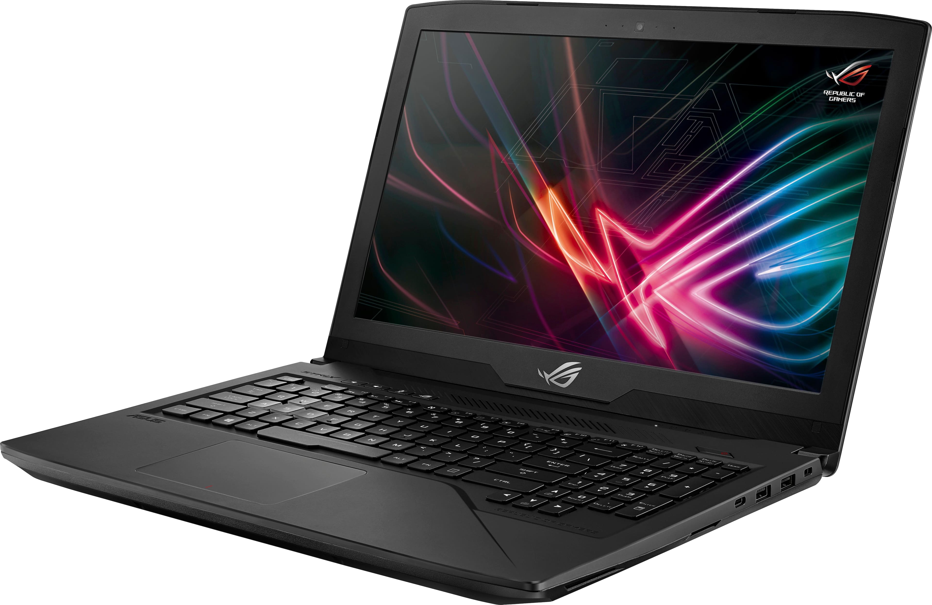 Left. ASUS - 15.6" Laptop - Intel Core i7 - 16GB Memory - NVIDIA GeForce GTX 1060 - 1TB Hard Drive + 128GB Solid State Drive - Soft touch black.