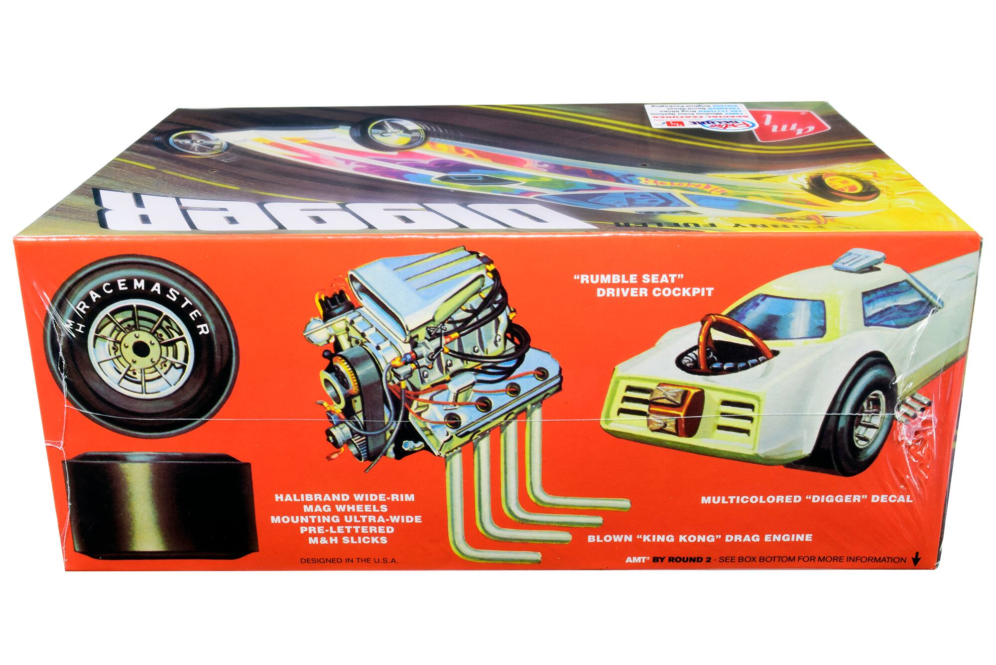 - "RUMBLE SEAT" DRIVER COCKPIT
- HALIBRAND WIDE-RIM MAG WHEELS
- MOUNTING ULTRA-WIDE PRE-LETTERED M&H SLICKS
- MULTICOLORED "DIGGER" DECAL
- BLOWN "KING KONG" DRAG ENGINE
- DESIGNED IN THE U.S.A.
- AMT BY ROUND 2 - SEE BOX BOTTOM FOR MORE INFORMATION